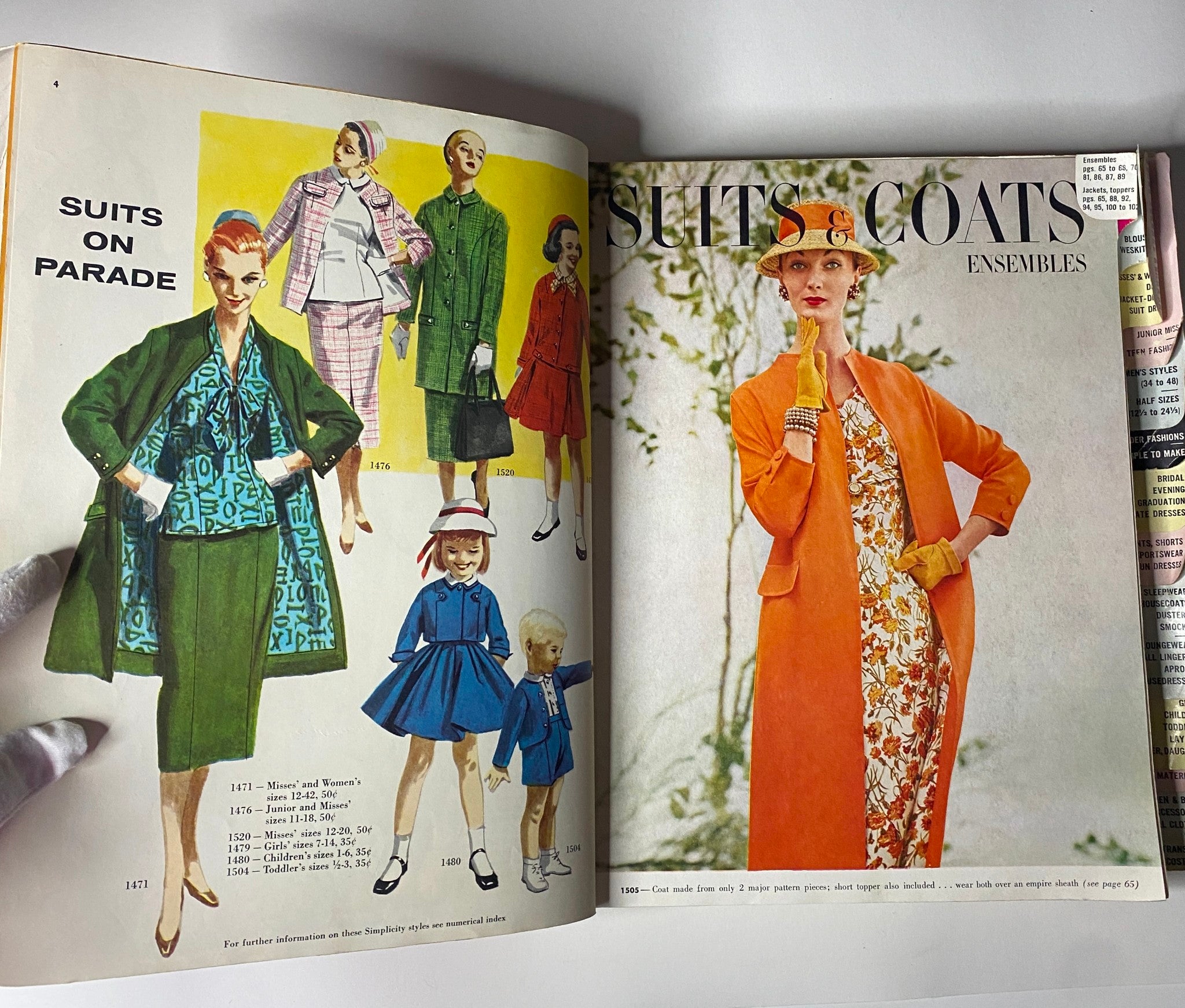 Interior page of the 1956 May Simplicity Sewing Pattern Catalog, illustrating various suits and coats for women and children, showcasing 1950s fashion ensembles.