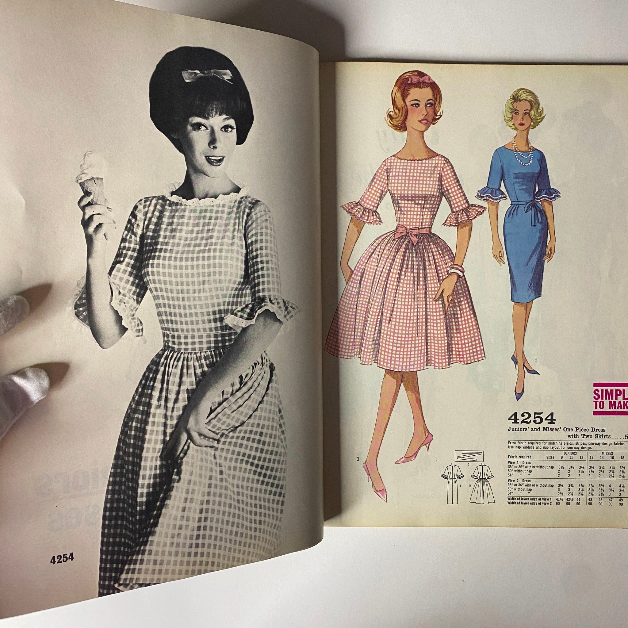 1962 Simplicity Spring Summer School Catalog Sewing Pattern Store Counter Book showcasing a model in a gingham dress on one side and fashion illustrations of dresses on the other side, highlighting the era's youth fashion.
