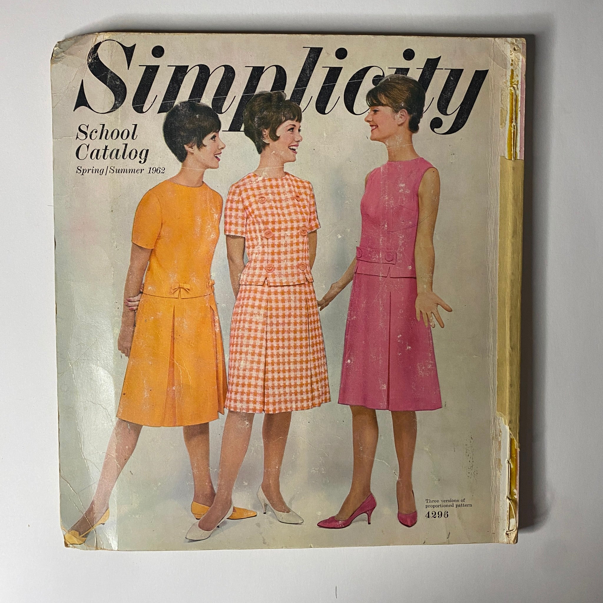 1962 Simplicity Spring Summer School Catalog cover featuring three women in stylish dresses showcasing vintage fashion patterns for school wear, demonstrating classic styles from the early 1960s.
