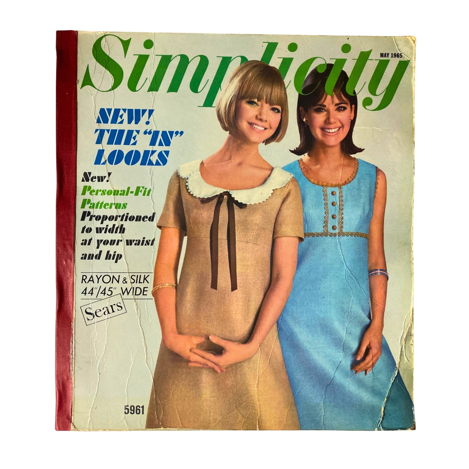 1965 May Simplicity Catalog Sewing Pattern cover featuring stylish women in dresses, showcasing the latest fashion trends of the year.