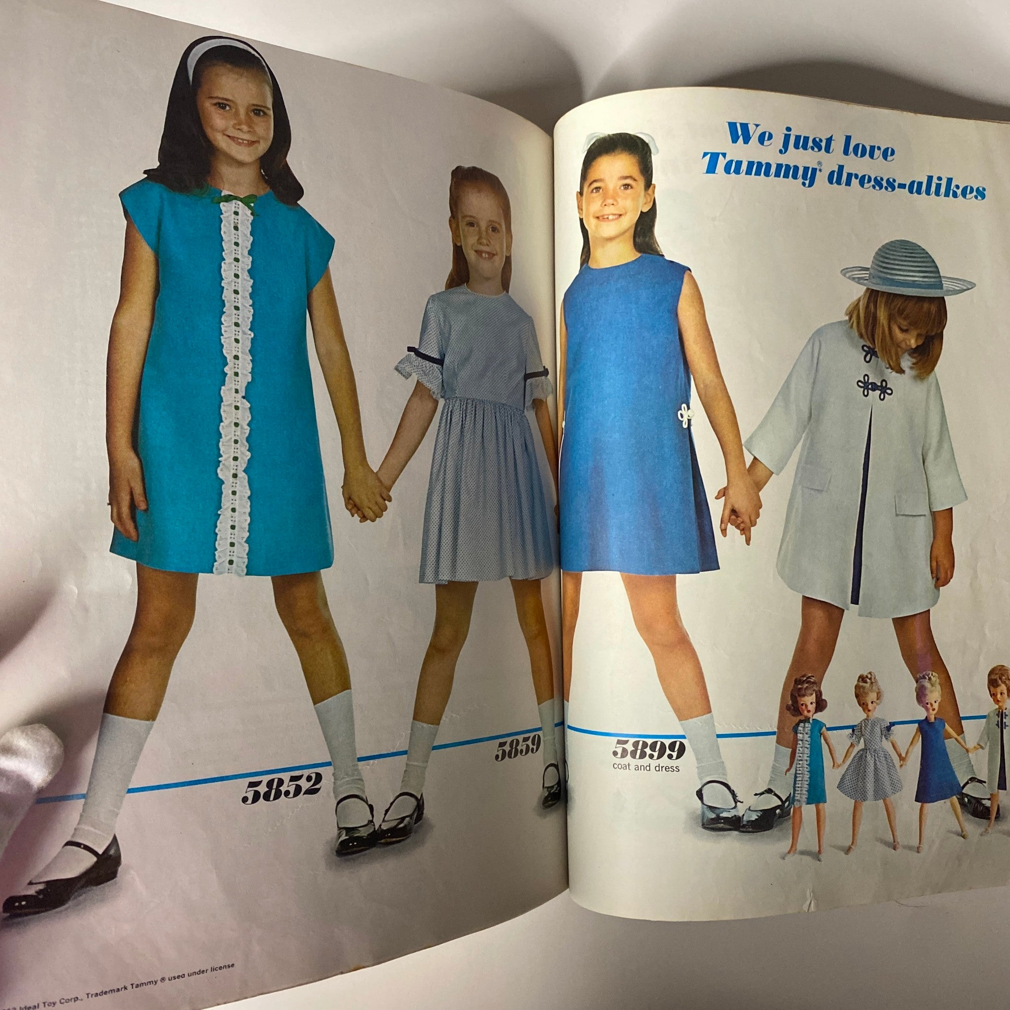 1965 May Simplicity Catalog image emphasizing children's fashion with models showcasing matching dresses and outfits, highlighting styles for young girls.