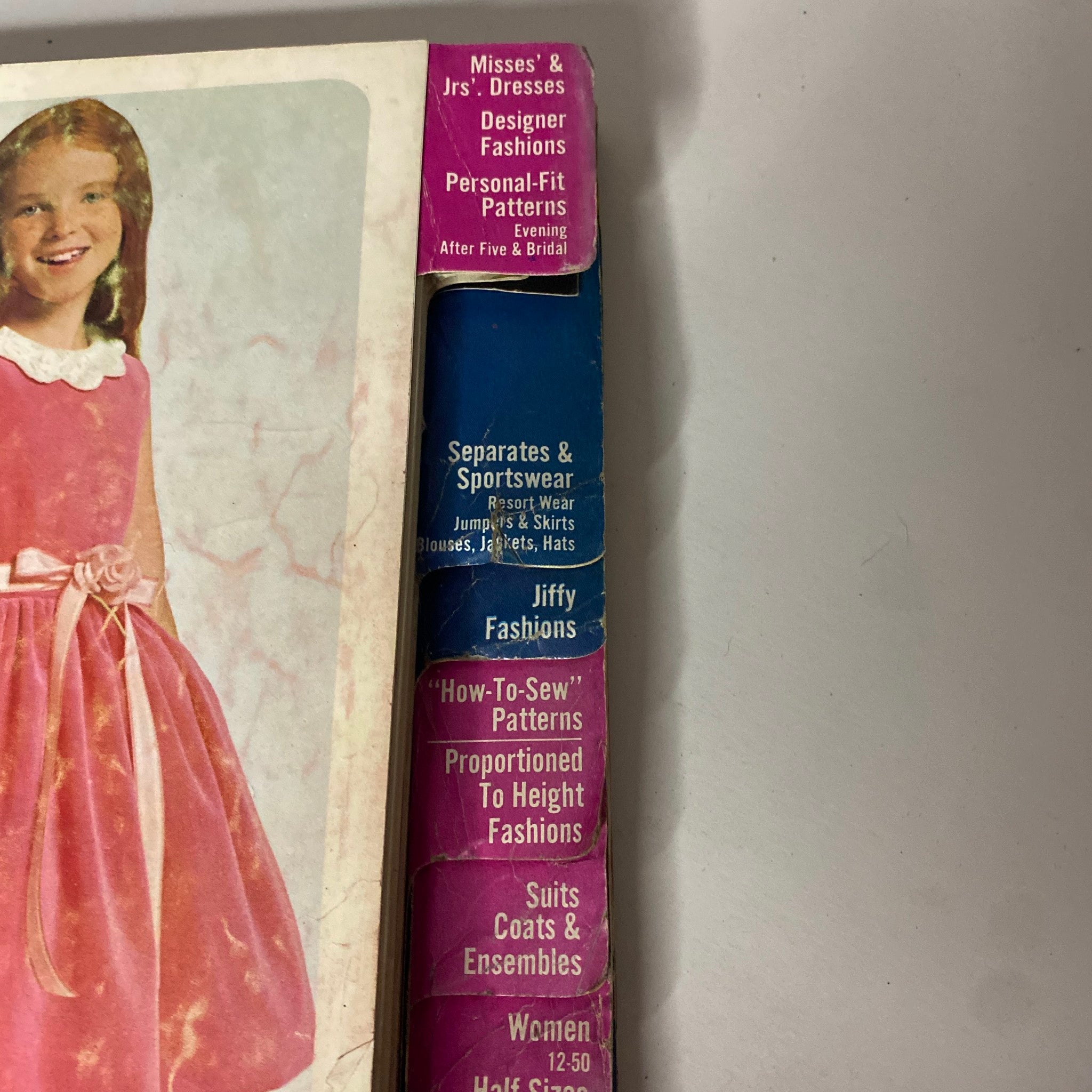 Cover of the 1965 December Simplicity Christmas Catalog sewing pattern, showcasing children's dresses and sewing pattern categories including Misses' and Jrs' dresses, personal-fit patterns, and more.