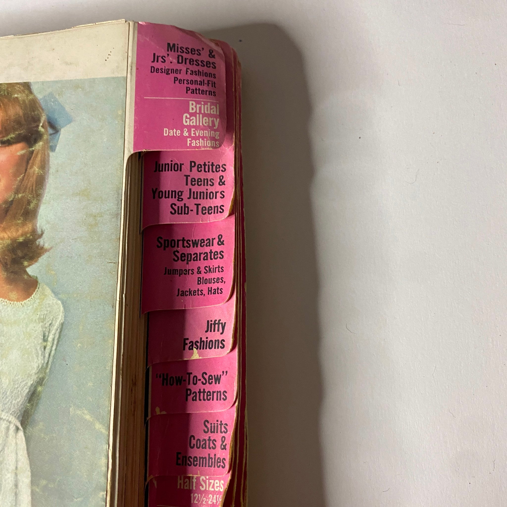 Close-up of the 1966 May Simplicity Fashion Catalog, highlighting the detailed sections for various sewing patterns, including bridal and children's fashion.