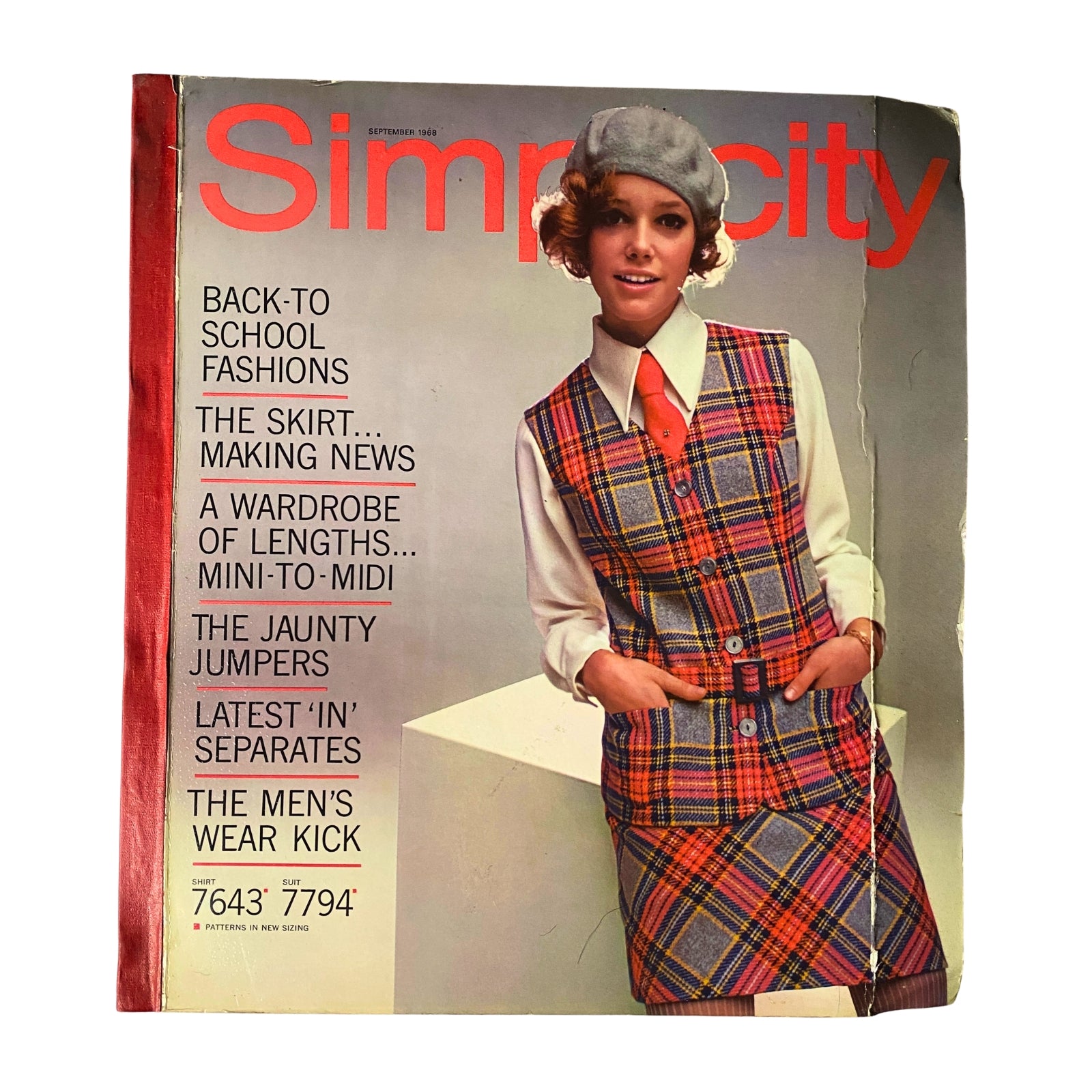 1968 September Simplicity Catalog featuring a model in retro back-to-school fashion, showcasing a plaid vest and skirt ensemble. Perfect for sewing enthusiasts and vintage fashion collectors.
