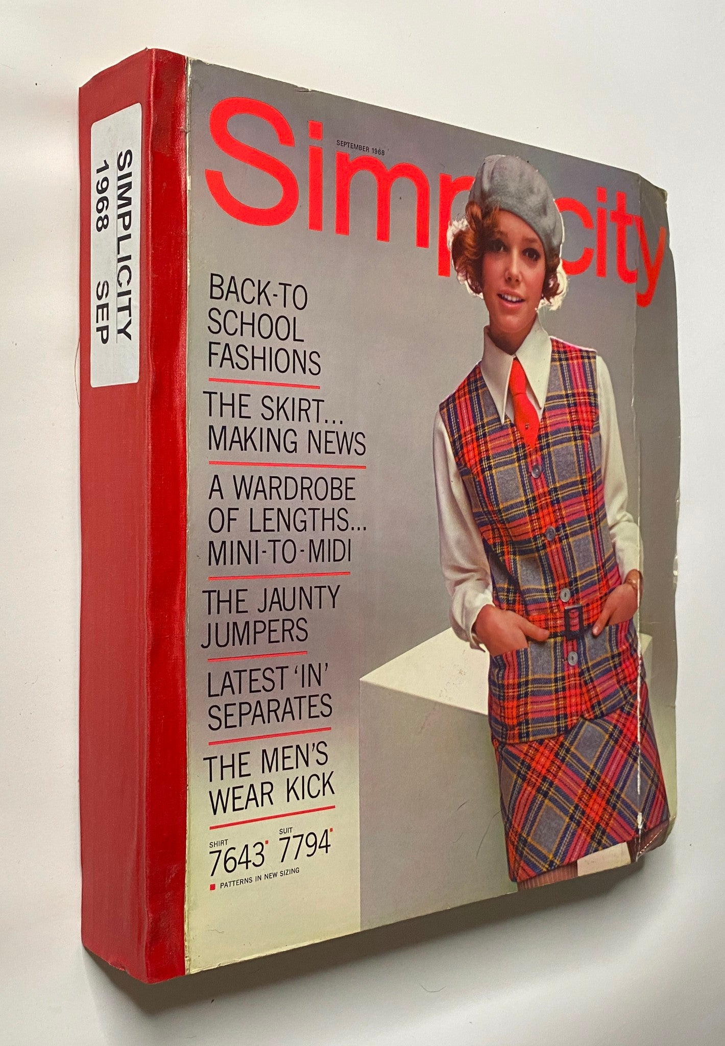 1968 September Simplicity Catalog side view, highlighting the model in a checkered outfit. The cover promotes various fashion trends suitable for school and casual wear, ideal for vintage pattern fans.