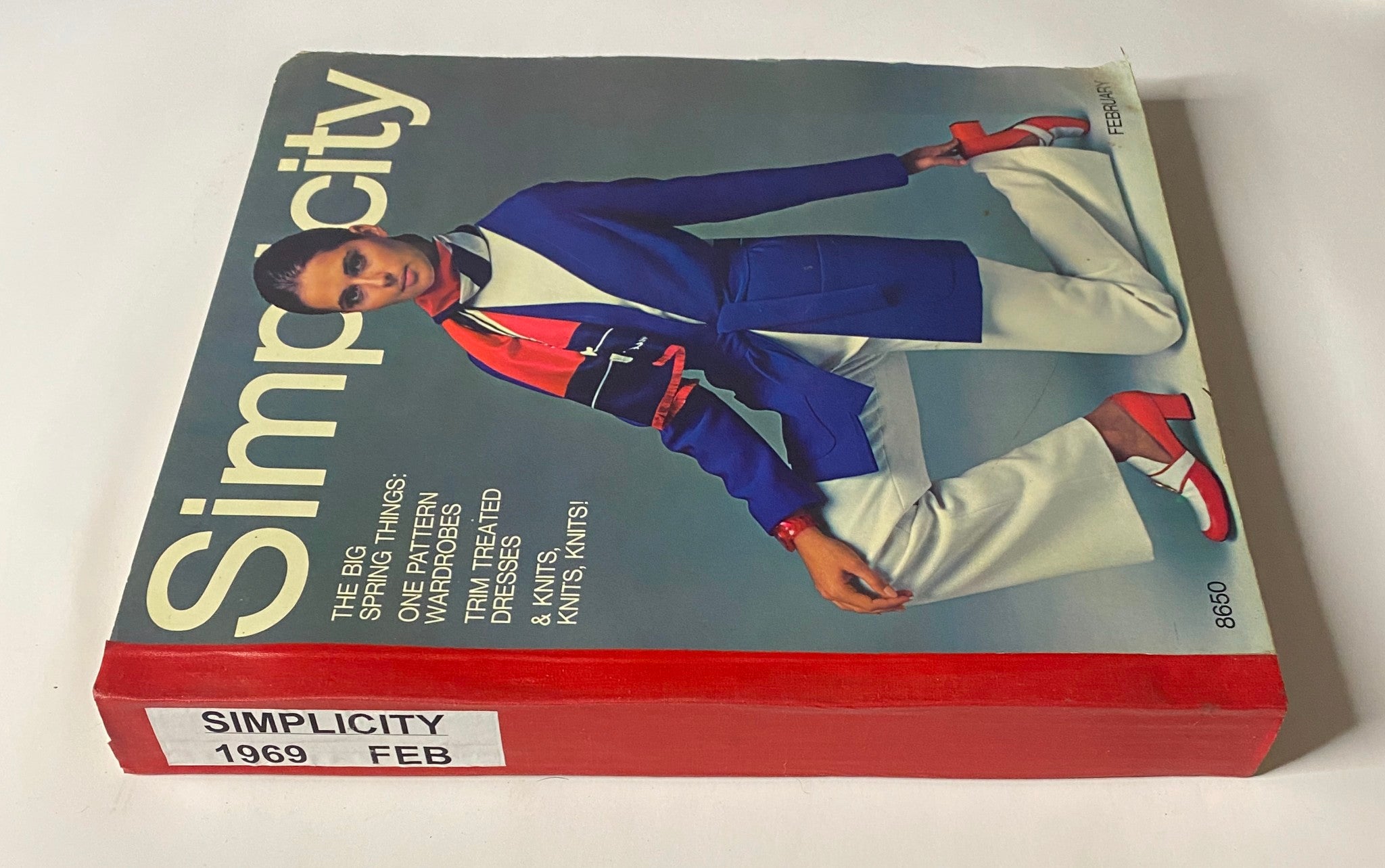 Side view of the 1969 February Simplicity Spring Catalog highlighting its vibrant cover and spring-themed fashion features.