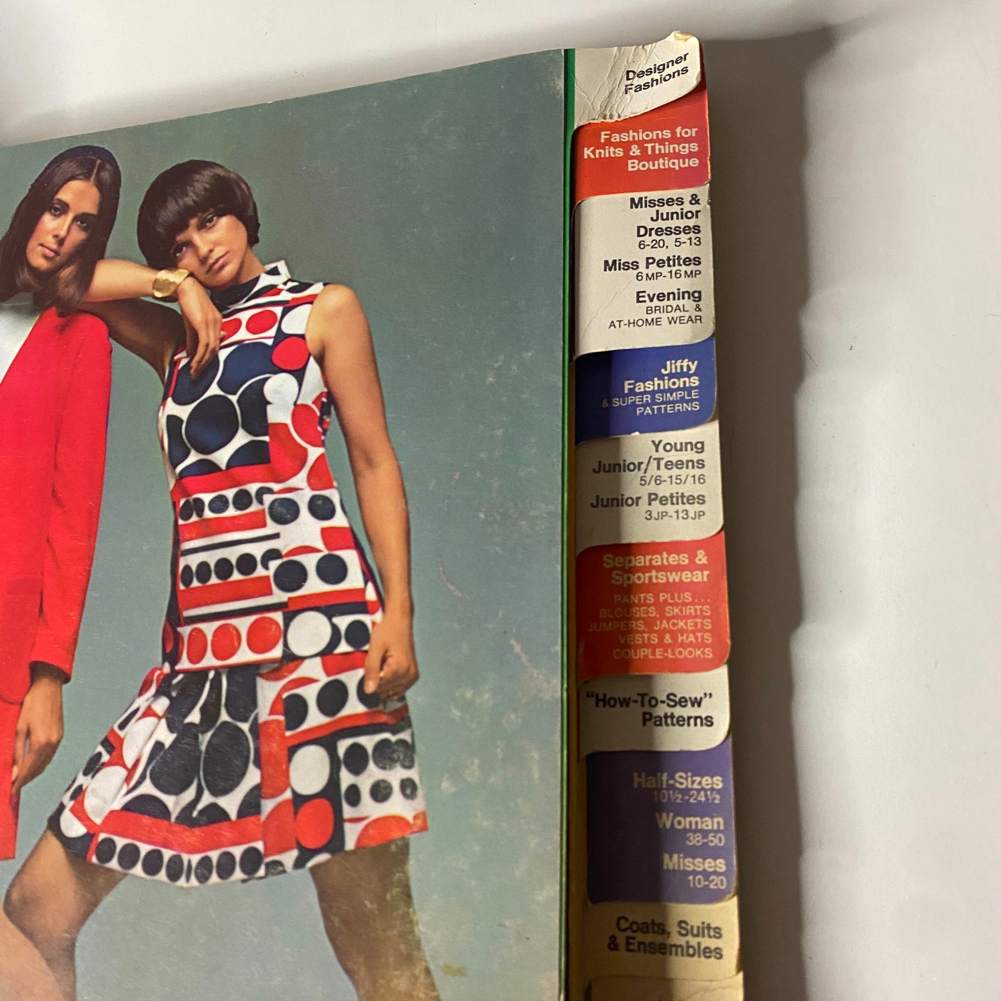 Detailed view of the 1969 February Simplicity Spring Catalog showing model outfits and fashion types including Jiffy fashions and evening wear.