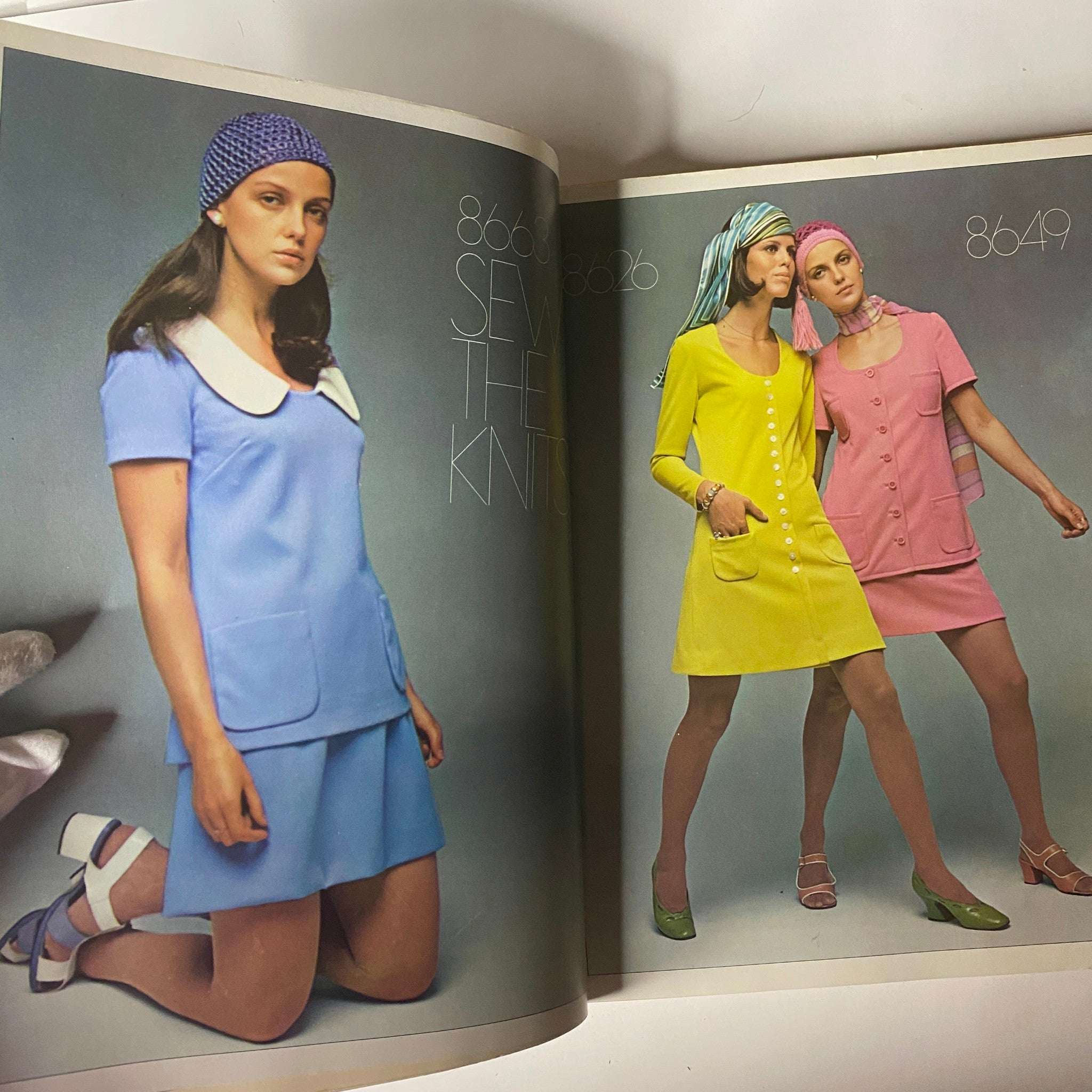 1970 March Simplicity Spring Catalog displaying a model in a blue dress and another wearing a yellow outfit, both emphasizing knitwear fashion of the era.