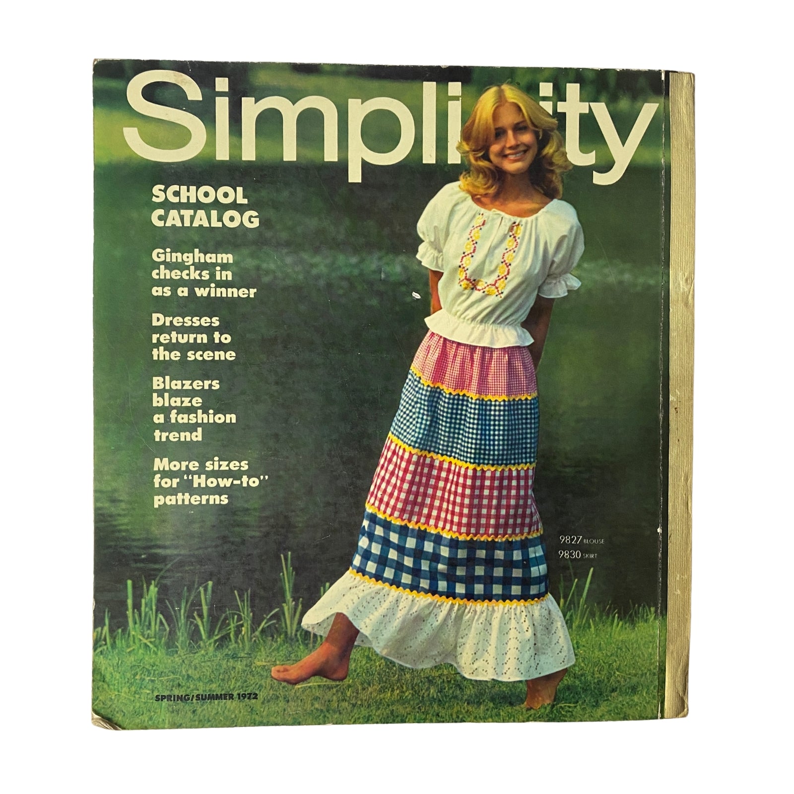 1972 Simplicity Spring and Summer Catalog cover displaying a young model in a traditional style outfit with gingham skirt and white blouse, emphasizing the fashion trends from the era.