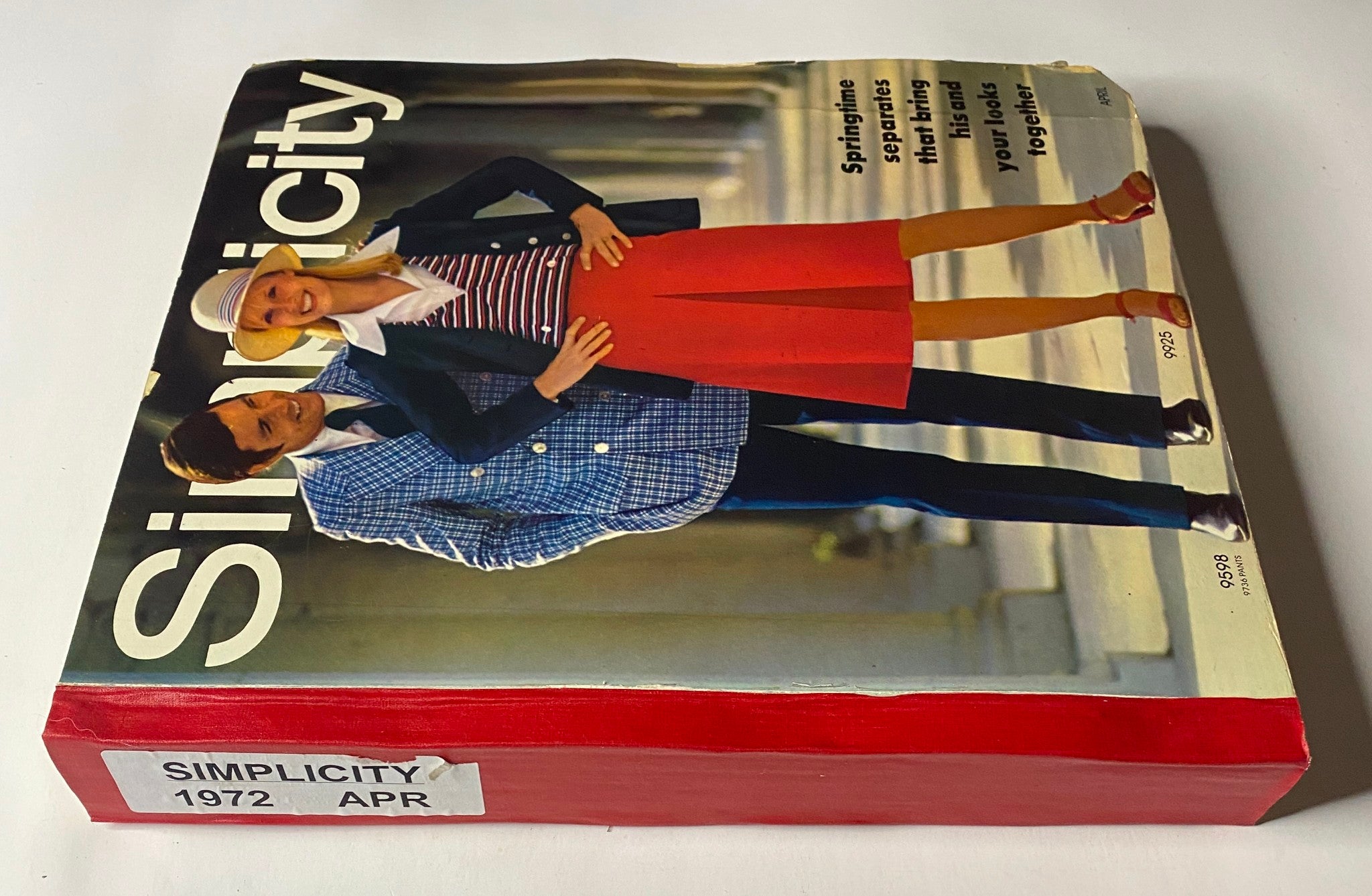 Side view of the 1972 April Simplicity Spring Catalog sewing pattern store counter book highlighting fashionable spring separates for both men and women, emphasizing early '70s trends.