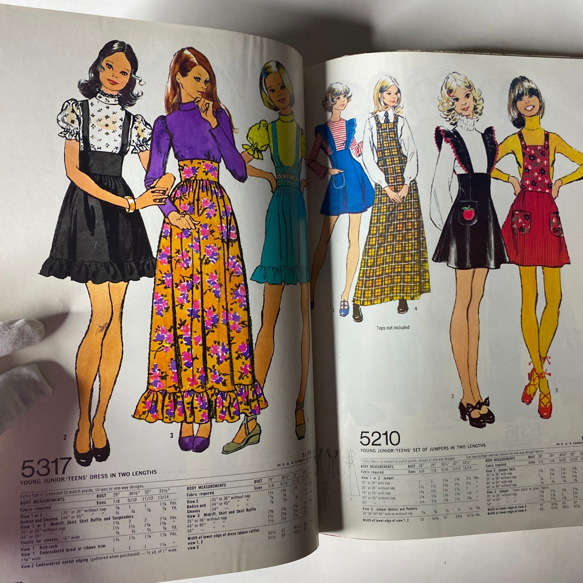 1972 December Simplicity Catalog presenting young junior/teens dress patterns 5317 and 5210, emphasizing trendy styles for youthful fashion.