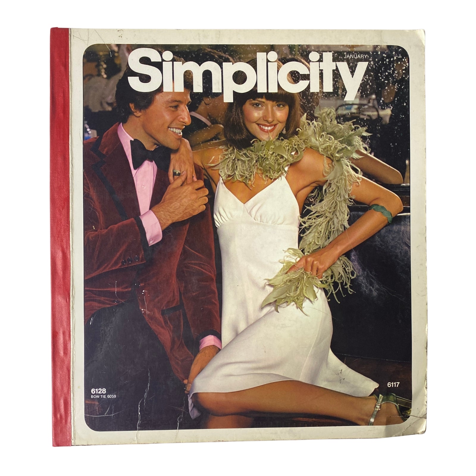 Cover of the 1973 January Simplicity Catalog featuring stylish sewing patterns for men and women. The image showcases a couple dressed in fashionable evening wear, embodying the creative possibilities of sewing with Simplicity patterns.