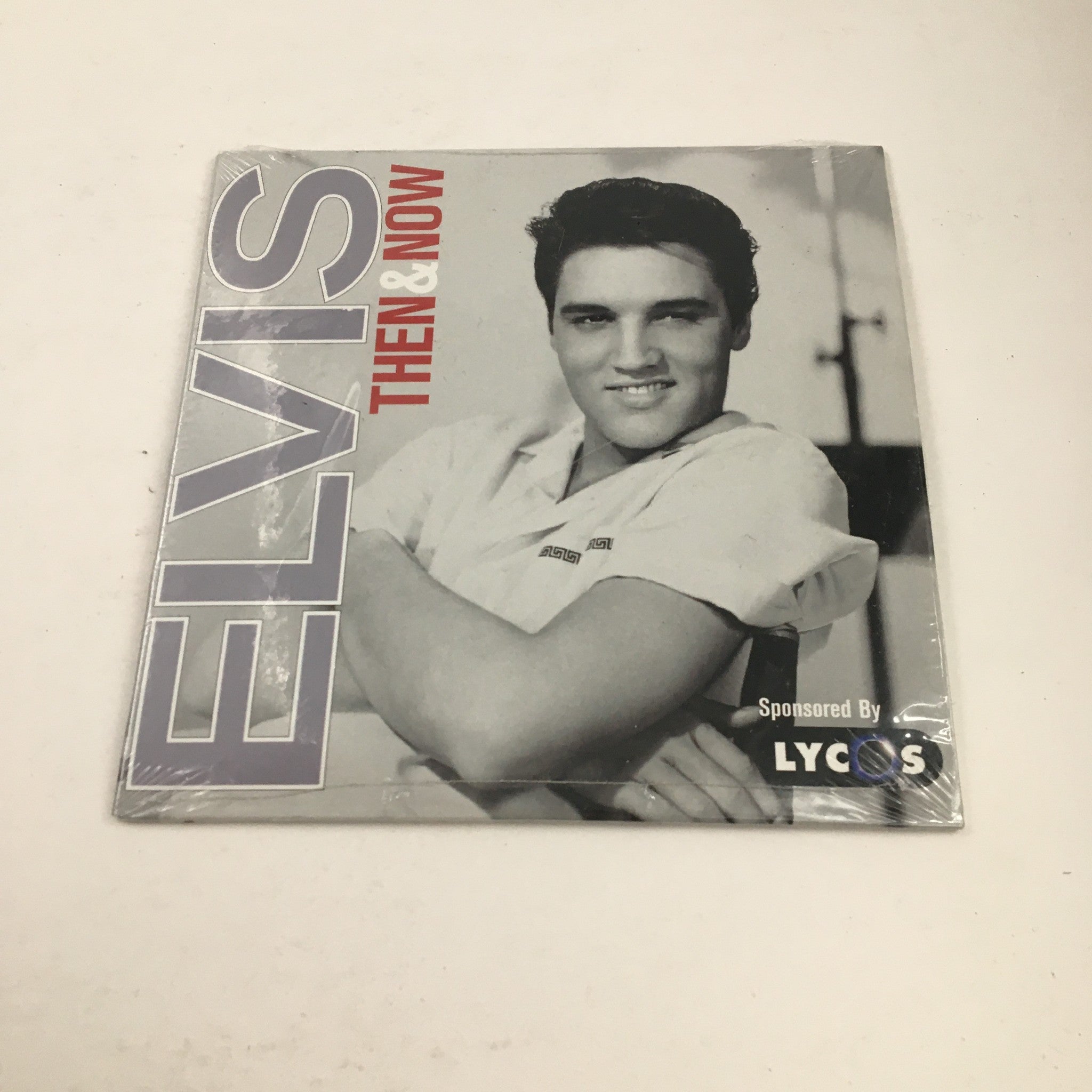 Elvis Presley Then & Now Official Graceland 25th Anniversary Collector's Edition album cover with Elvis Presley.