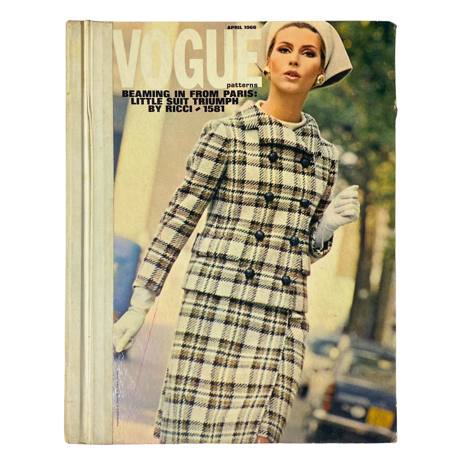 1966 Vogue Patterns April Catalog featuring a model in a stylish checked suit with gloves, showcasing mid-60s fashion elegance.
