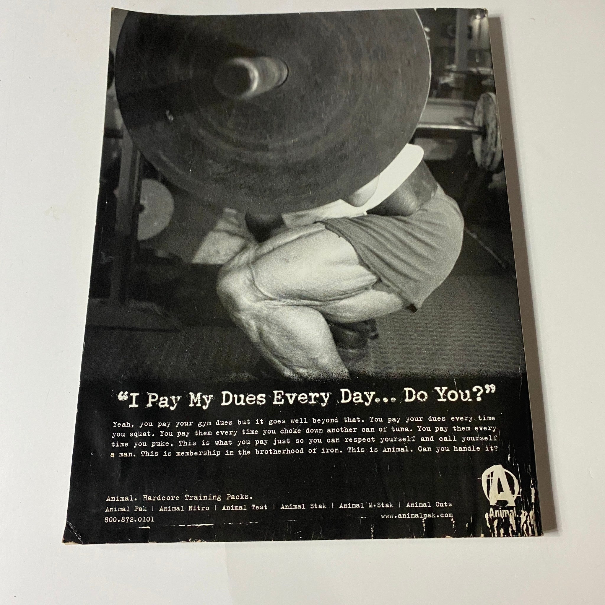 Back cover of Iron Man Magazine September 2004, featuring a motivational fitness quote, emphasizing dedication and hard work in training.