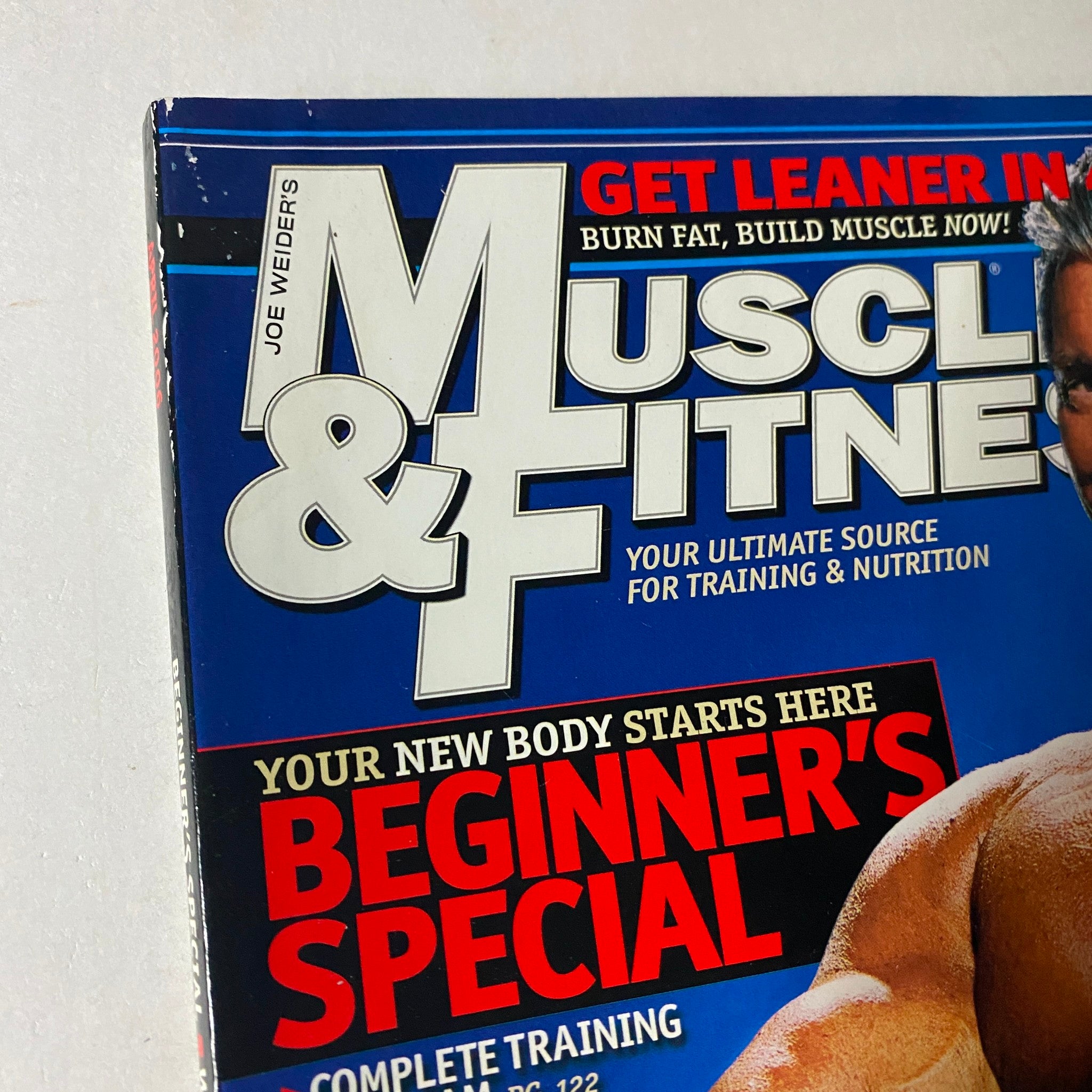 Close-up detail of the Muscle & Fitness Magazine April 2006 cover, emphasizing the magazine's focus on training, nutrition, and Vince McMahon's features.