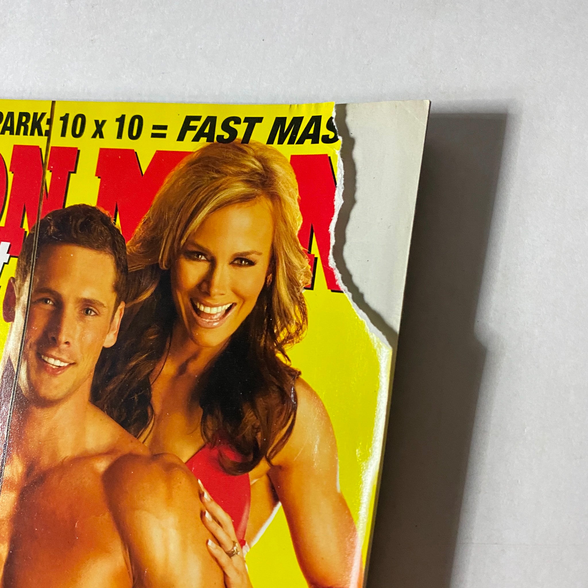 Close-up of the Iron Man Magazine June 2009 cover highlighting the wear on the edge while featuring Sean Harley and Allison Eithier.