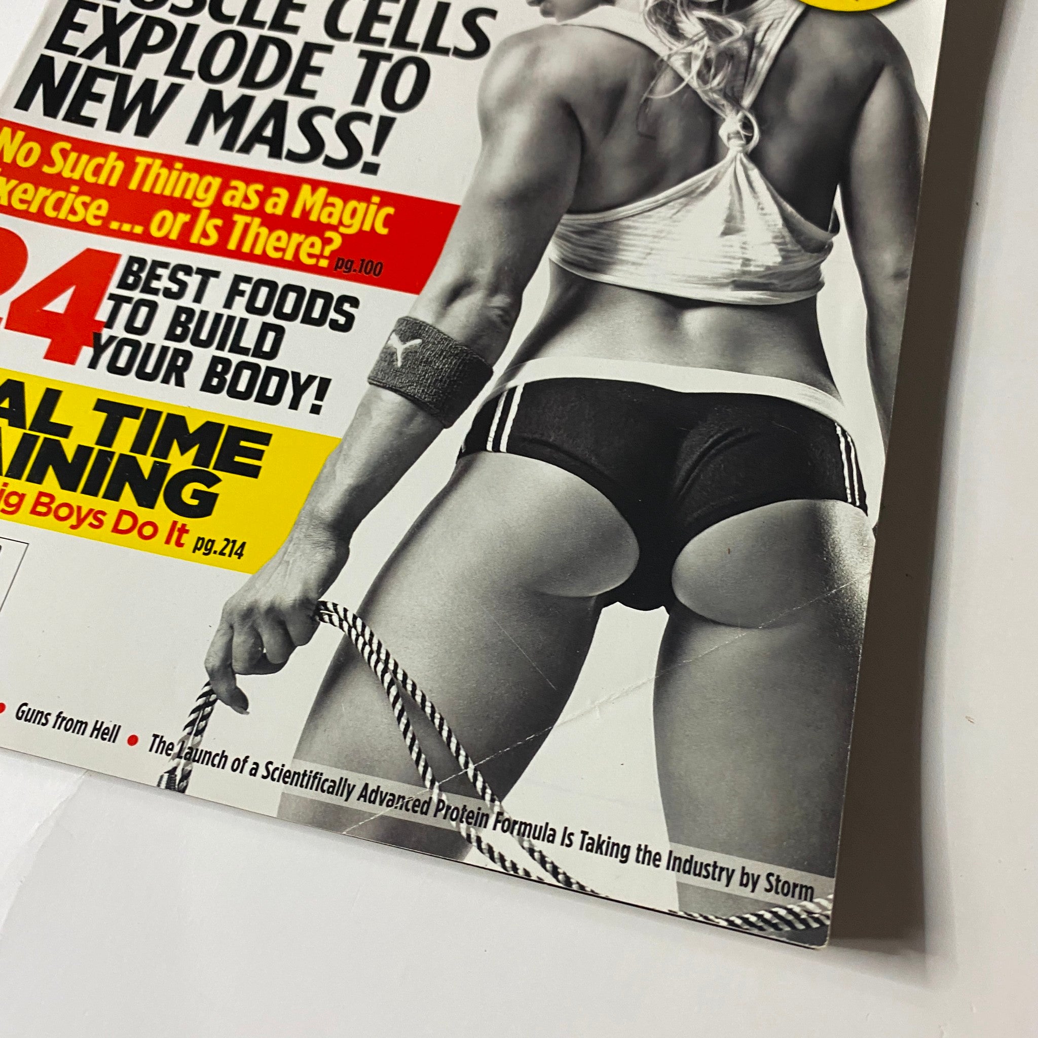 Close-up of MuscleMag Magazine December 2009 No. 331 highlighting fitness advice, including muscle growth and nutrition tips.