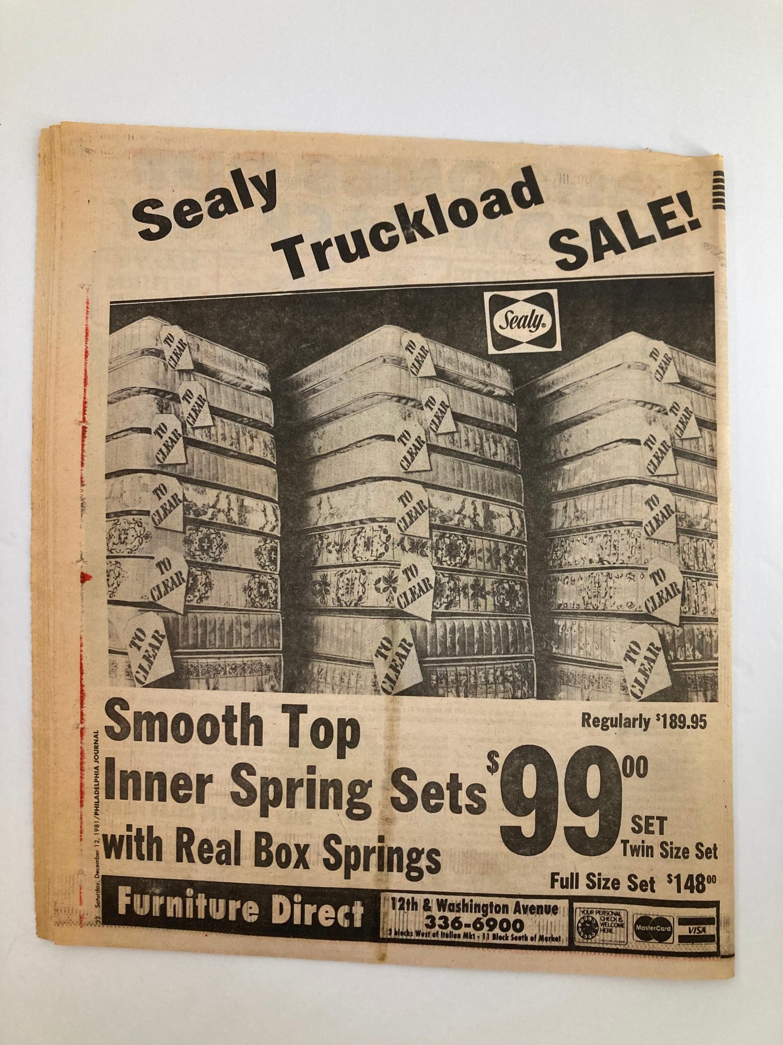Philadelphia Journal tabloid advertisement showcasing a Sealy Truckload Sale on smooth top inner spring mattress sets at discounted prices. Features the title and promotional details.