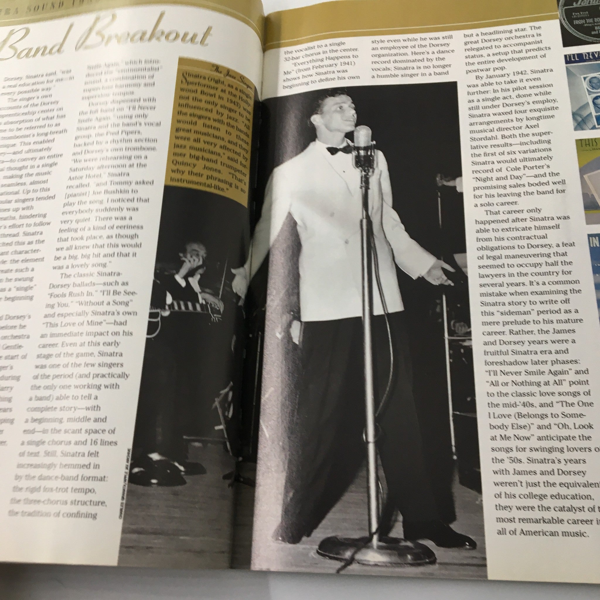 Frank Sinatra on stage during his breakout years, captured while performing with a band in the TV Guide Magazine.