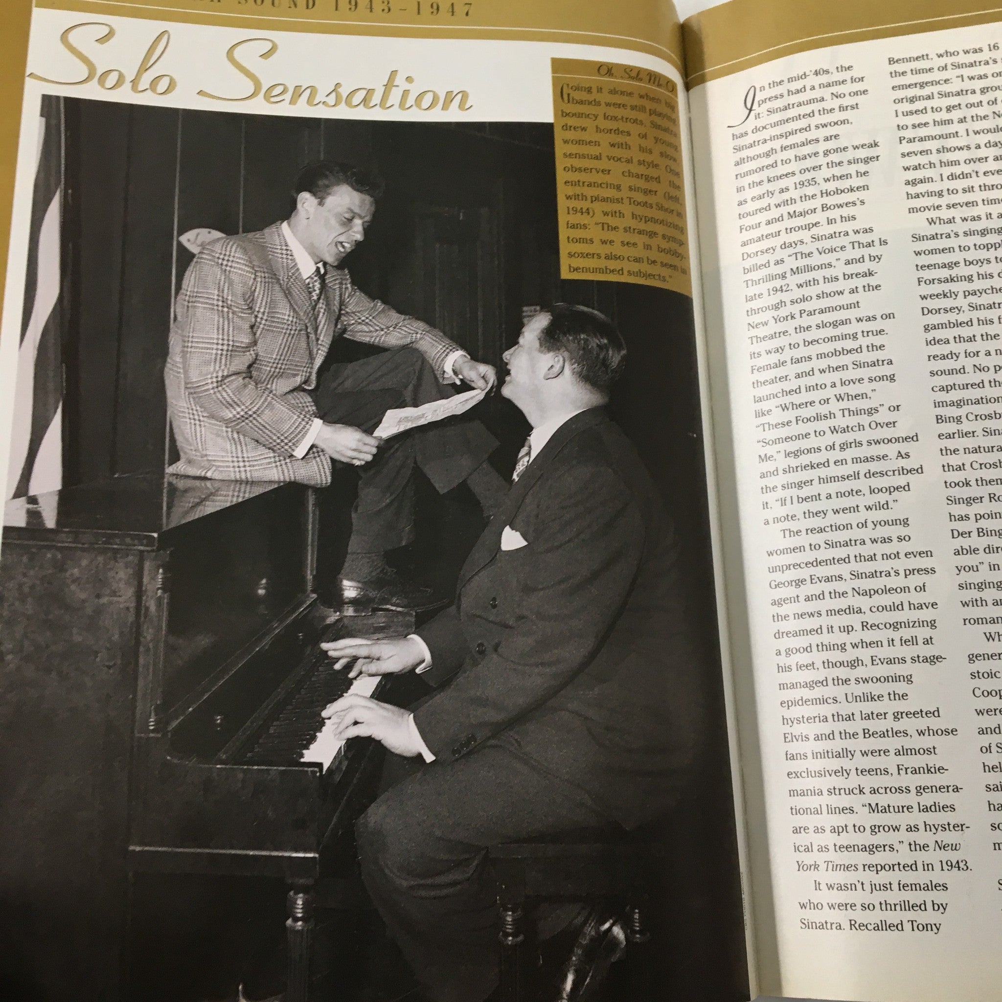 An engaging image from the TV Guide Magazine showing Frank Sinatra in a theatrical pose with a pianist, capturing the essence of his vibrant performances.