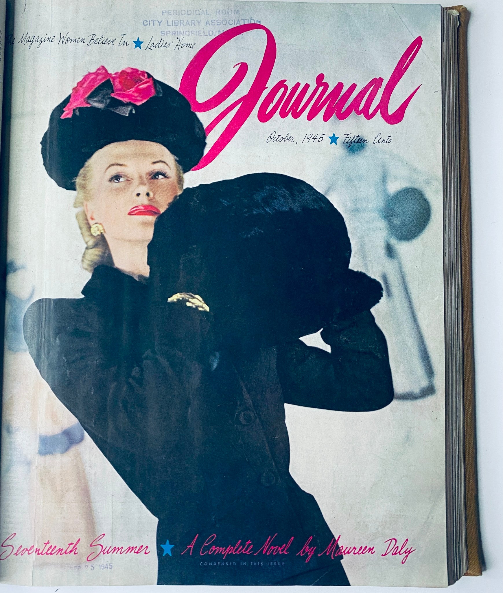 Cover of Ladies' Home Journal Bound Magazine for October 1945, featuring a fashionable woman in a striking hat, illustrating post-war women's fashion.