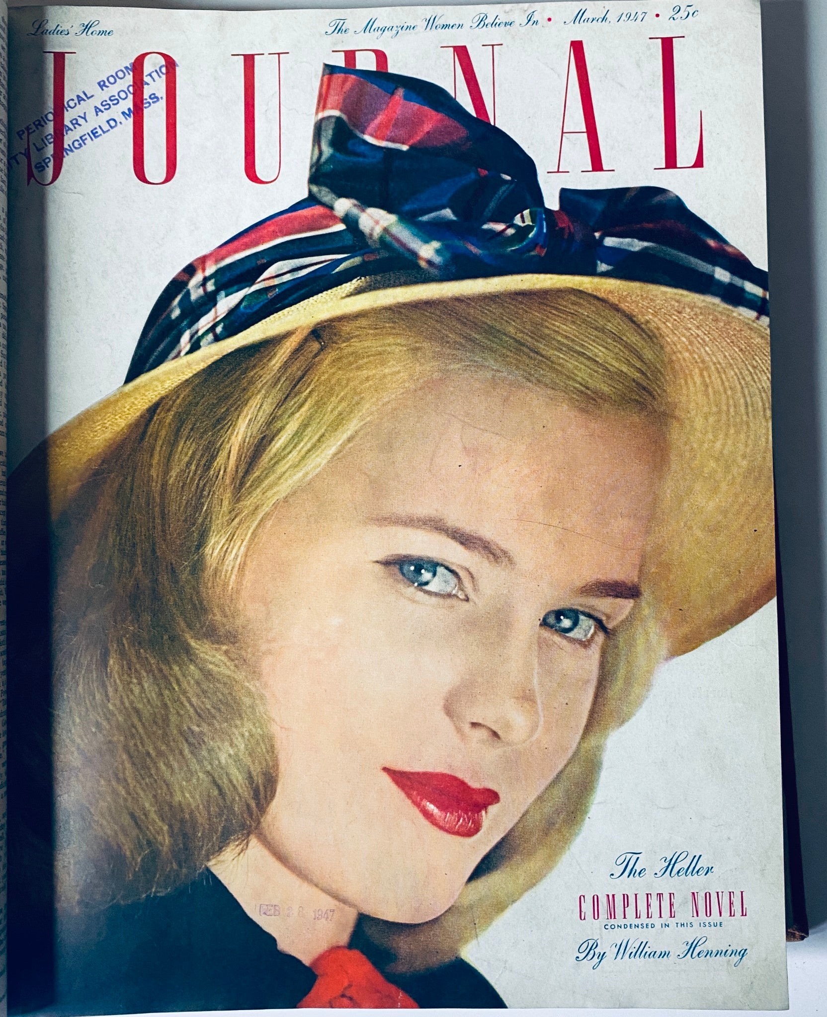 March 1947 cover of Ladies' Home Journal, portraying a glamorous woman with a hat and bold red lips.