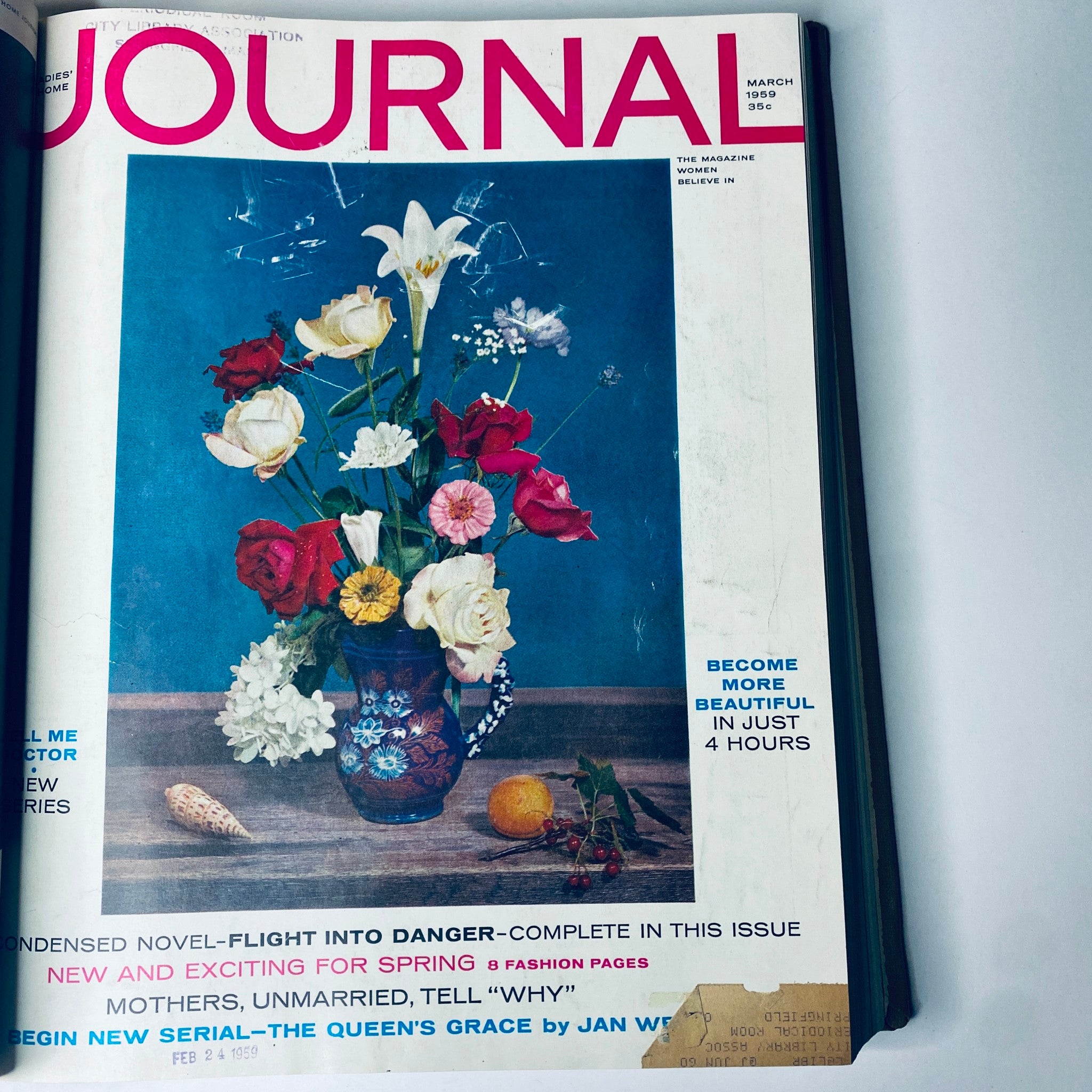 March 1959 cover of Ladies' Home Journal Bound Magazine showcasing a vibrant floral arrangement, indicative of spring themes in fashion and lifestyle during the era.