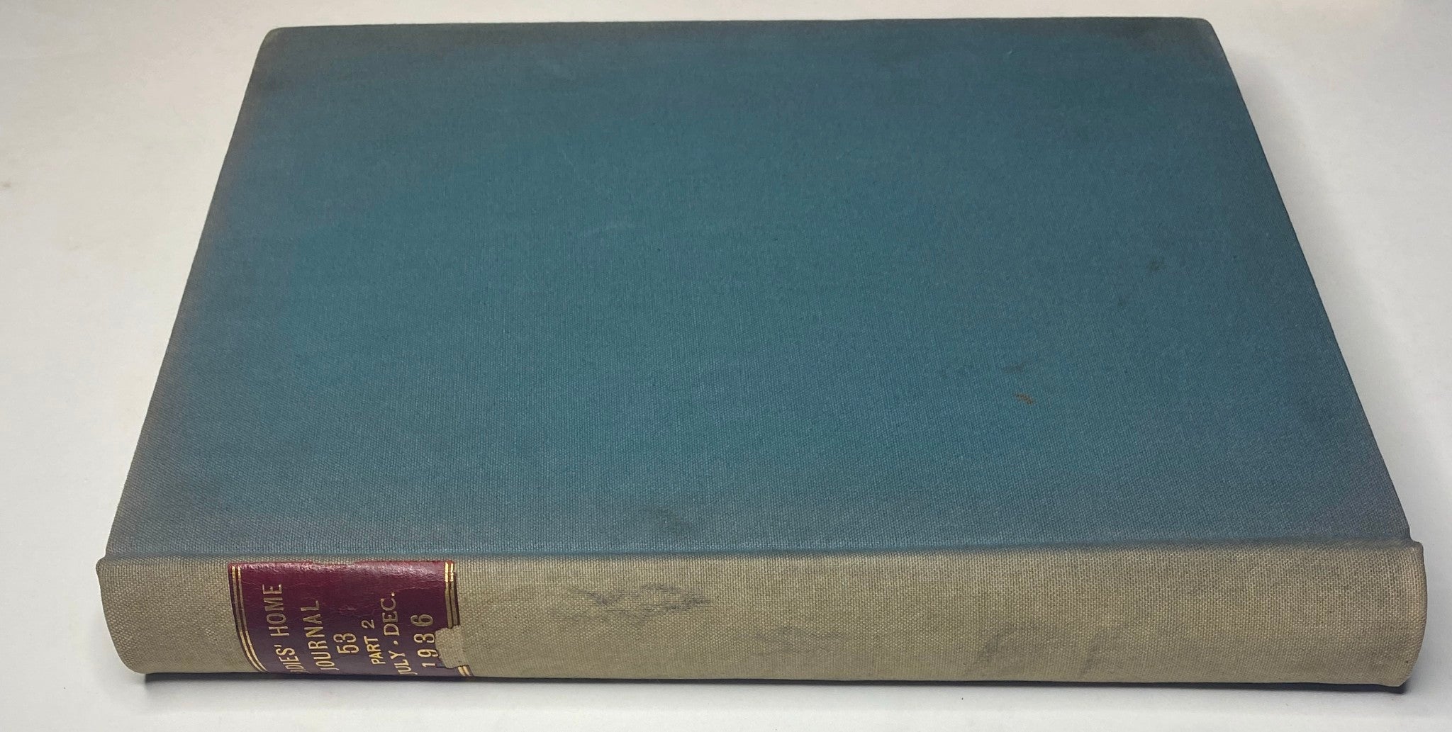 Side view of the Ladies' Home Journal Library Bound Magazine, highlighting the spine details in red and gold.