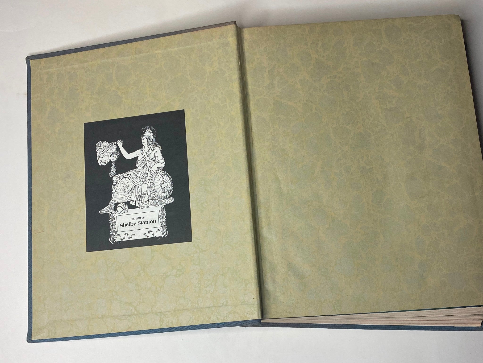 Interior view of the Ladies' Home Journal 1936 bound magazine, featuring an illustration by Shelby Stanton on the inside cover.
