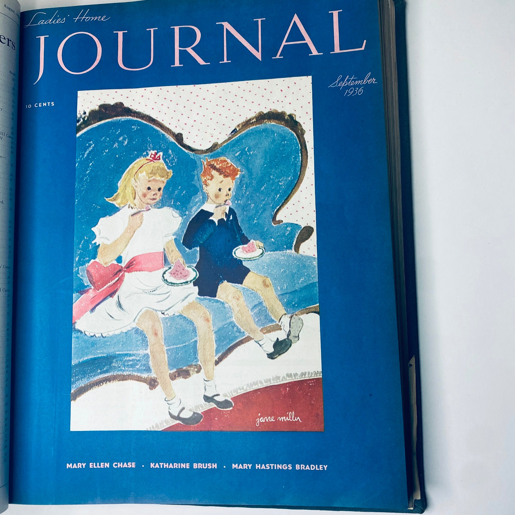 Cover page of the September 1936 Ladies' Home Journal magazine depicting two children enjoying treats on a couch, showcasing charming illustrations from the 1930s.