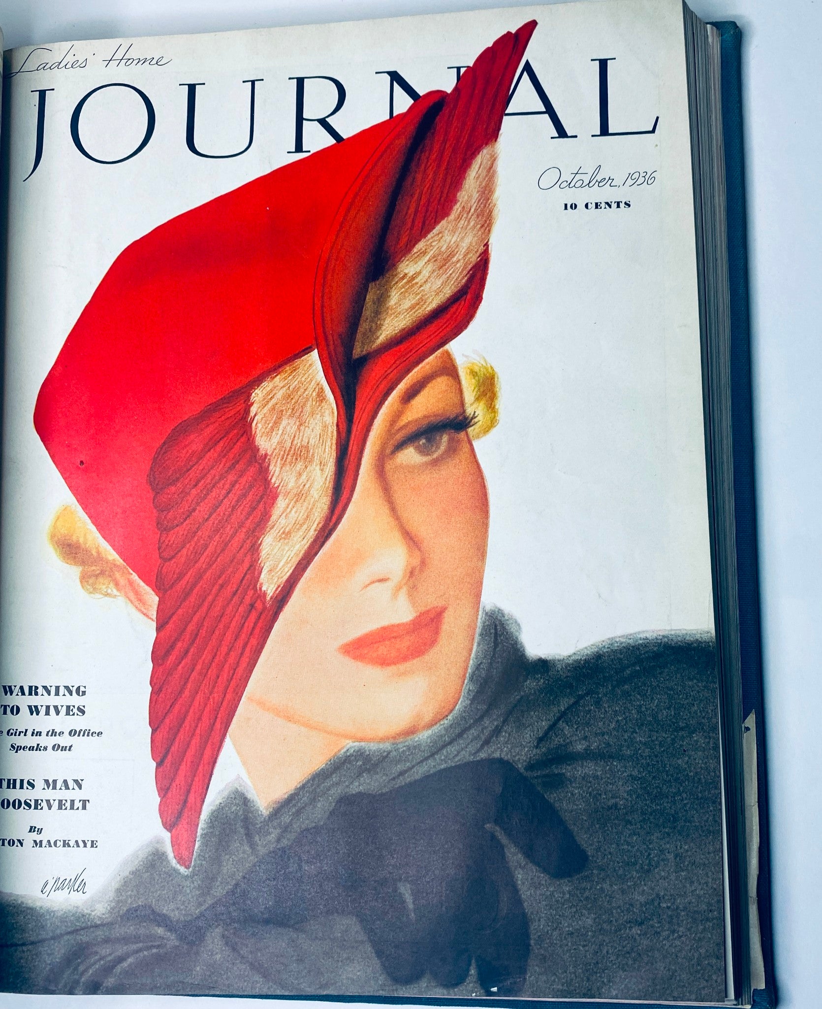 Cover page of the October 1936 Ladies' Home Journal magazine featuring a woman in an elegant red hat, highlighting vintage fashion aesthetics from the 1930s.