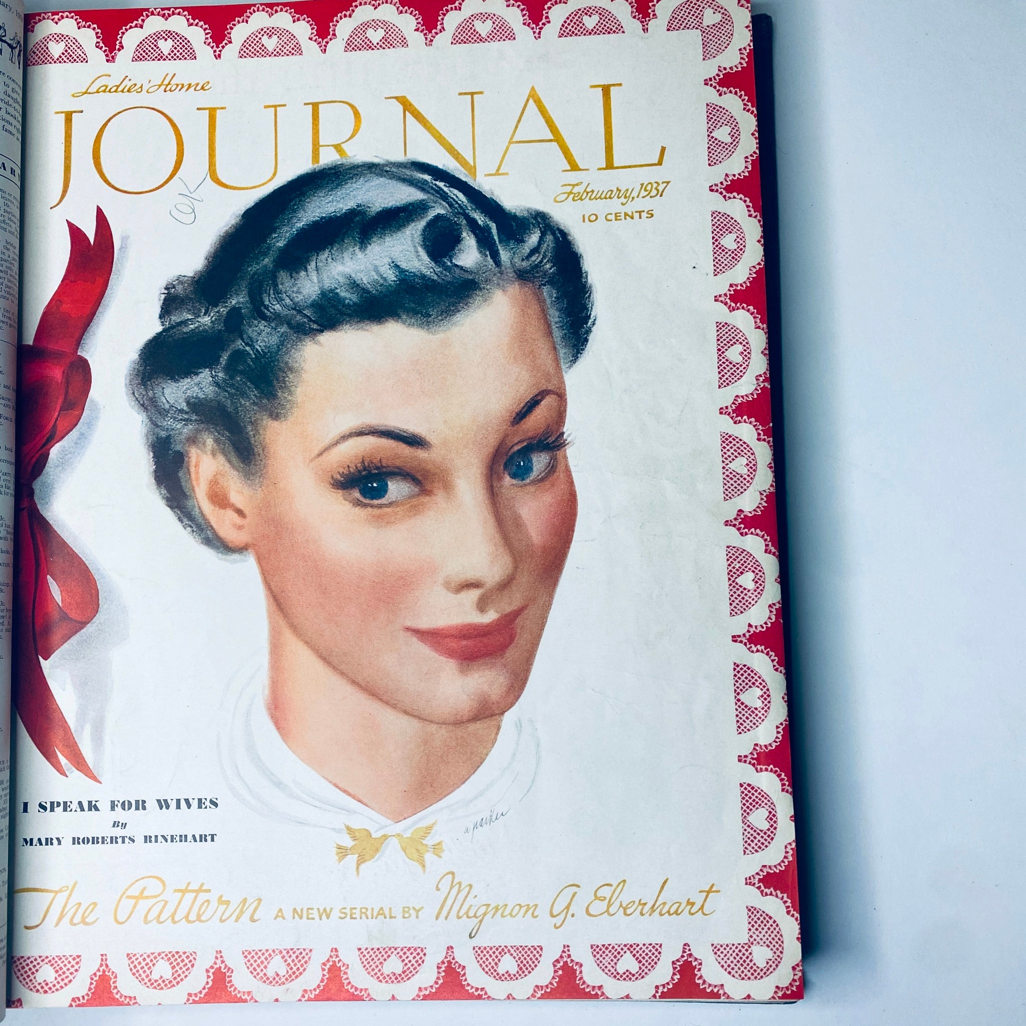 Cover of Ladies' Home Journal February 1937 featuring a woman's portrait with stylized hair, exhibiting vintage beauty and fashion trends.