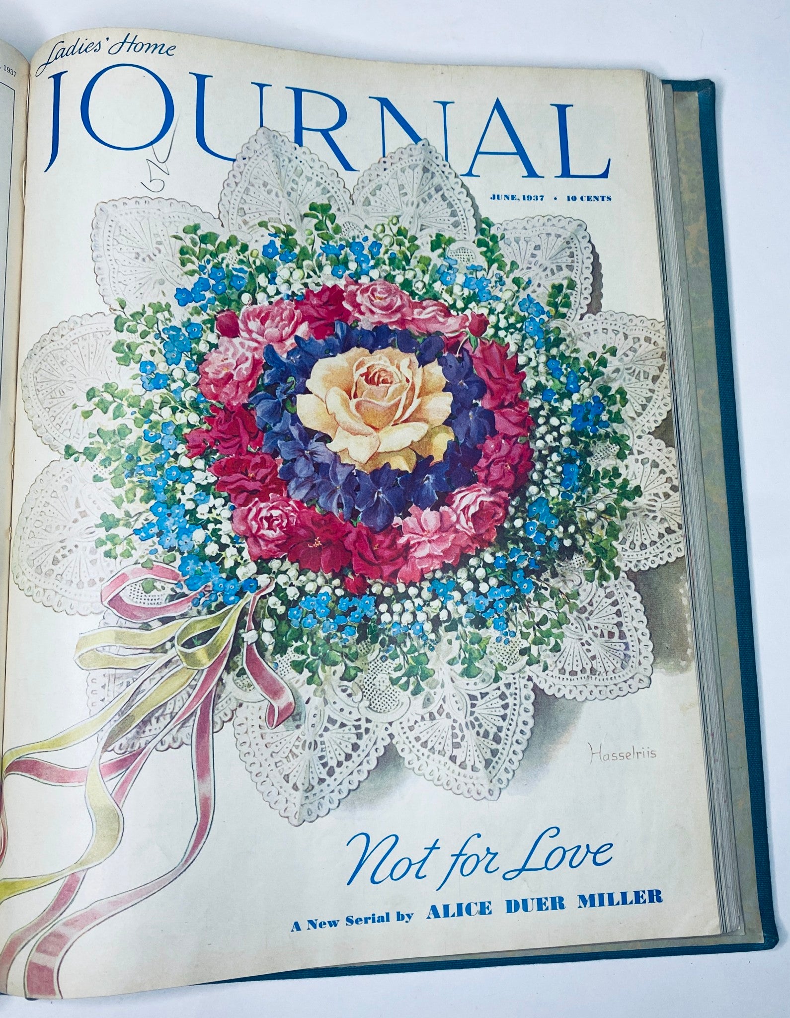 Cover of Ladies' Home Journal June 1937 showcasing a floral arrangement and lace design, representing the elegance and style of women's magazines from the 1930s.