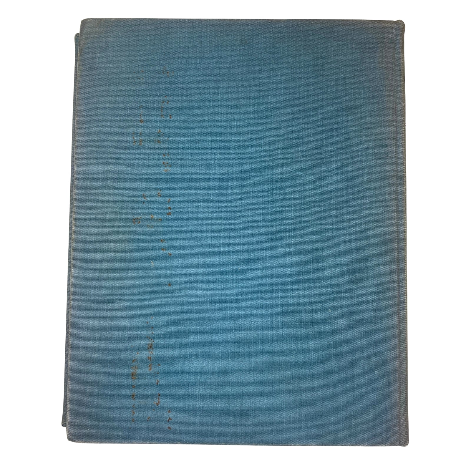 Back cover of a bound edition of Ladies' Home Journal 1937, displaying the worn blue fabric of the binding, highlighting its status as a complete year collection.