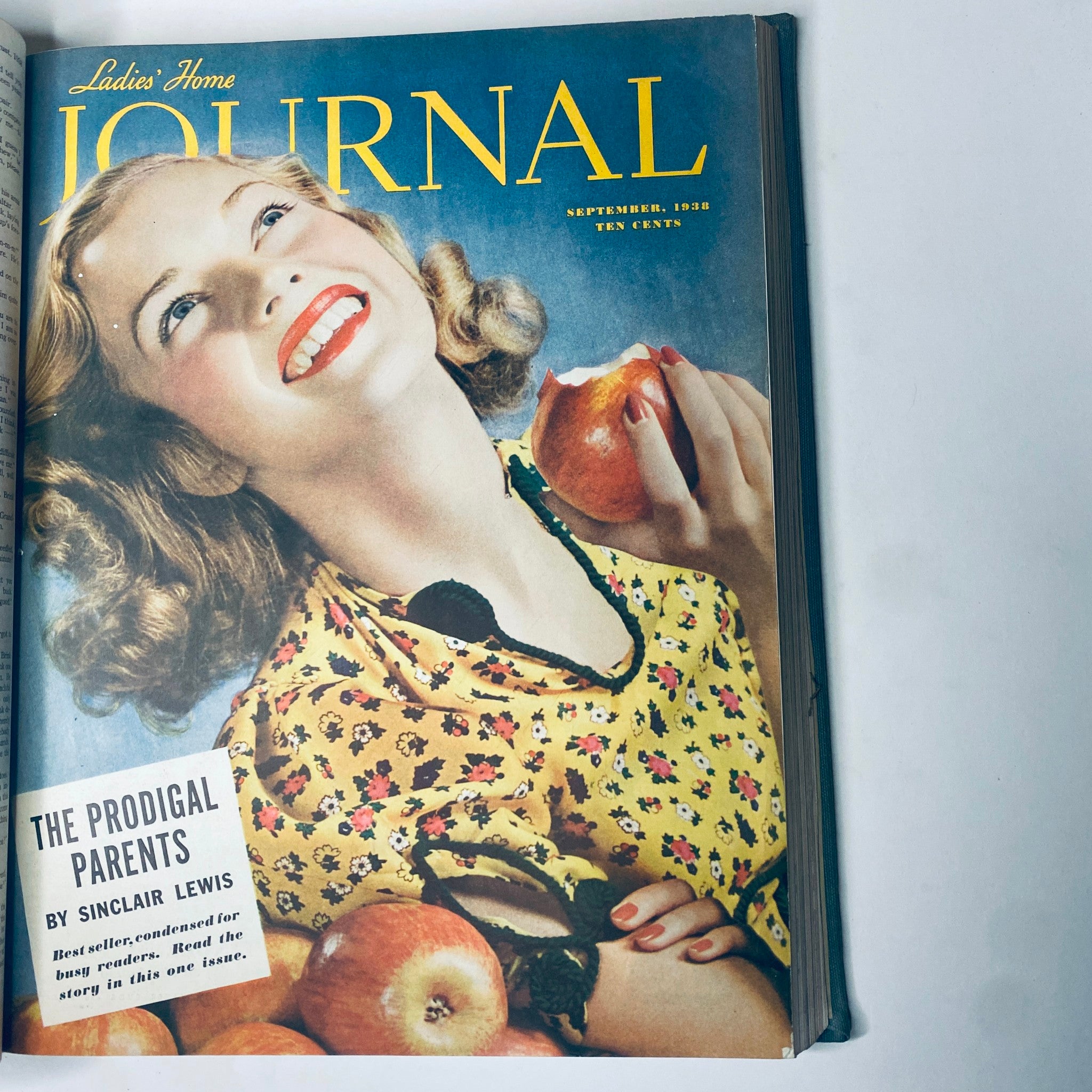 Cover of the Ladies' Home Journal September 1938 issue, displaying a joyful woman with an apple, symbolizing classic Americana and culinary themes.