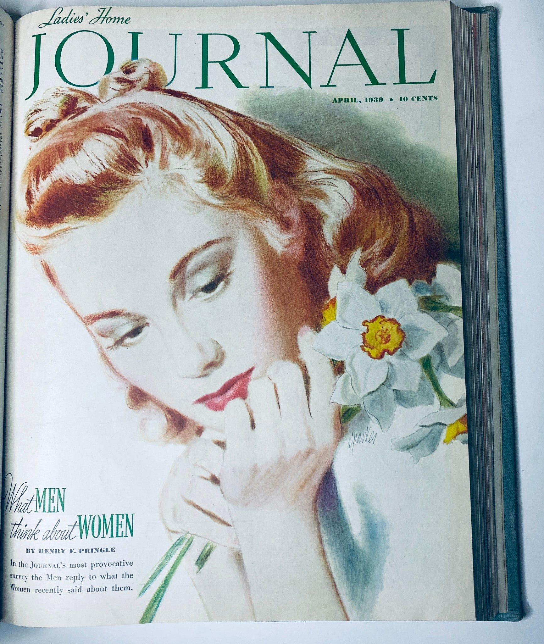 Cover of Ladies' Home Journal, April 1939, depicting a woman with flowers, exploring the theme of beauty and femininity.