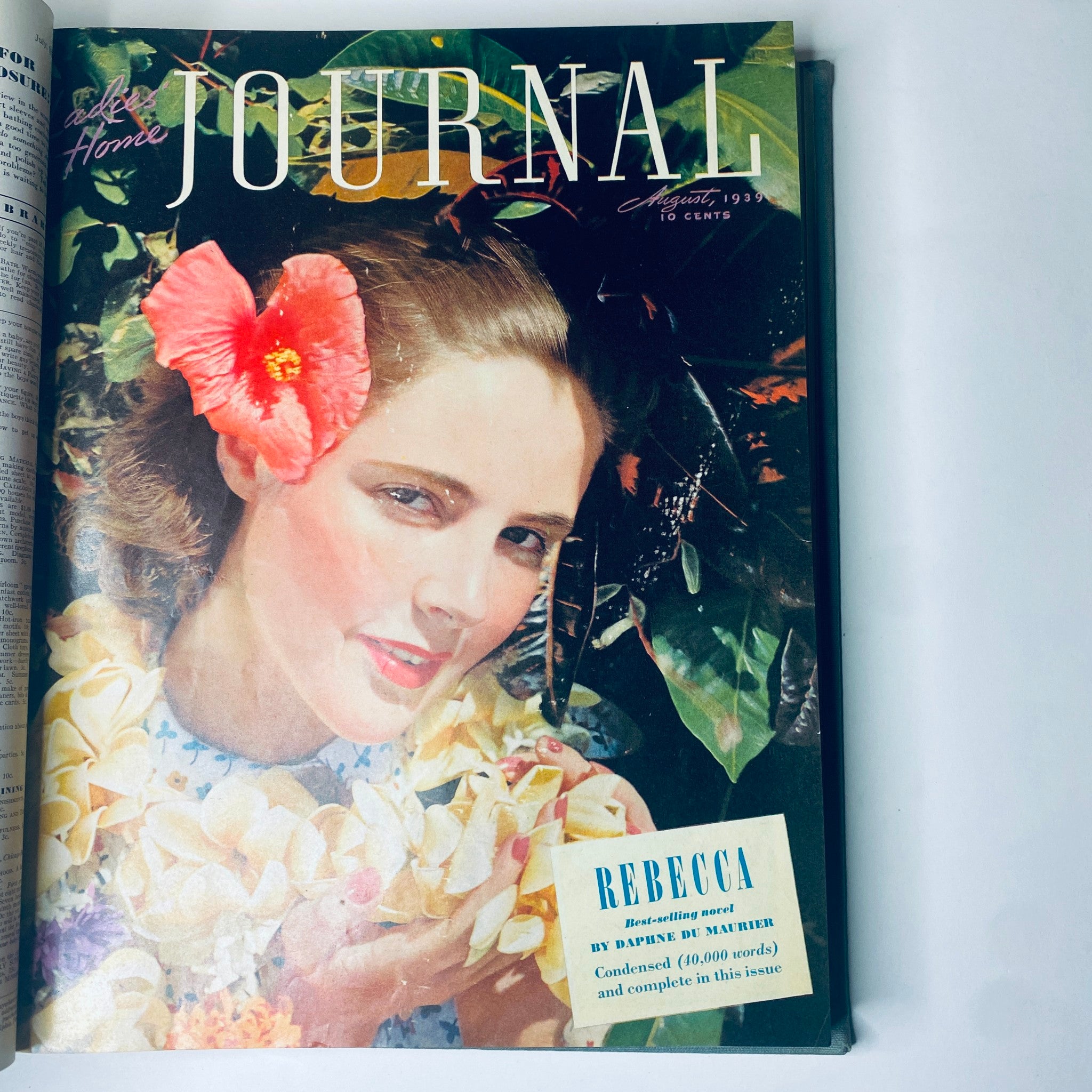 Cover of Ladies' Home Journal August 1939 featuring a woman with a flower in her hair. This bound magazine includes the complete year from January to December 1939.