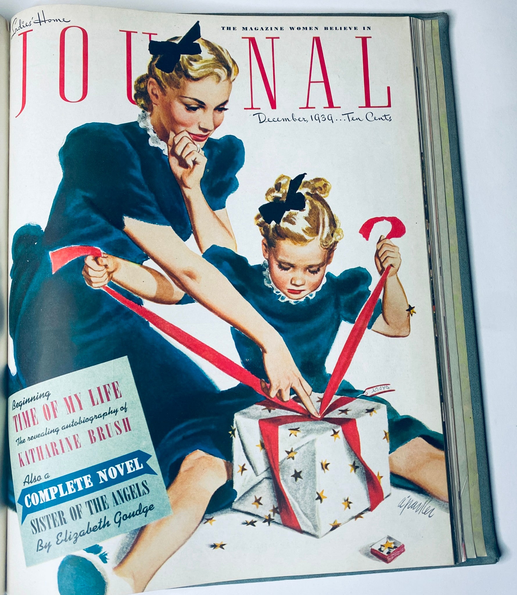 Cover of Ladies' Home Journal December 1939 illustrating a woman and child opening a gift. Part of the complete collection for the year 1939, from January to December.
