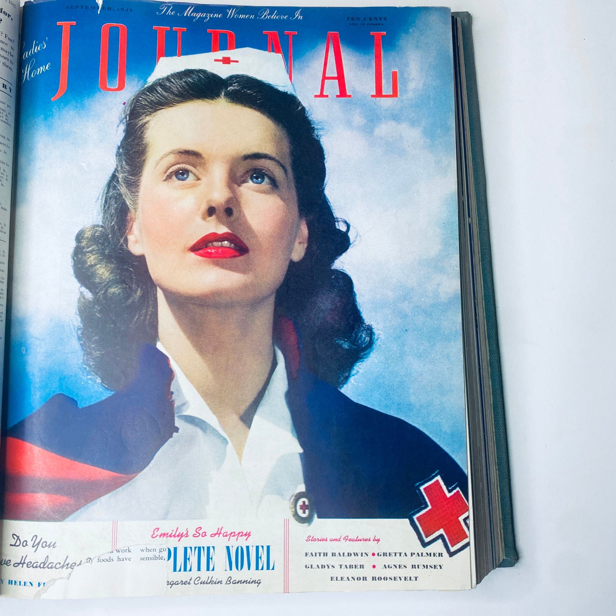 Cover of Ladies' Home Journal September 1941 showing a woman dressed as a nurse, gazing upwards. This image is part of the 1941 collection of the magazine.