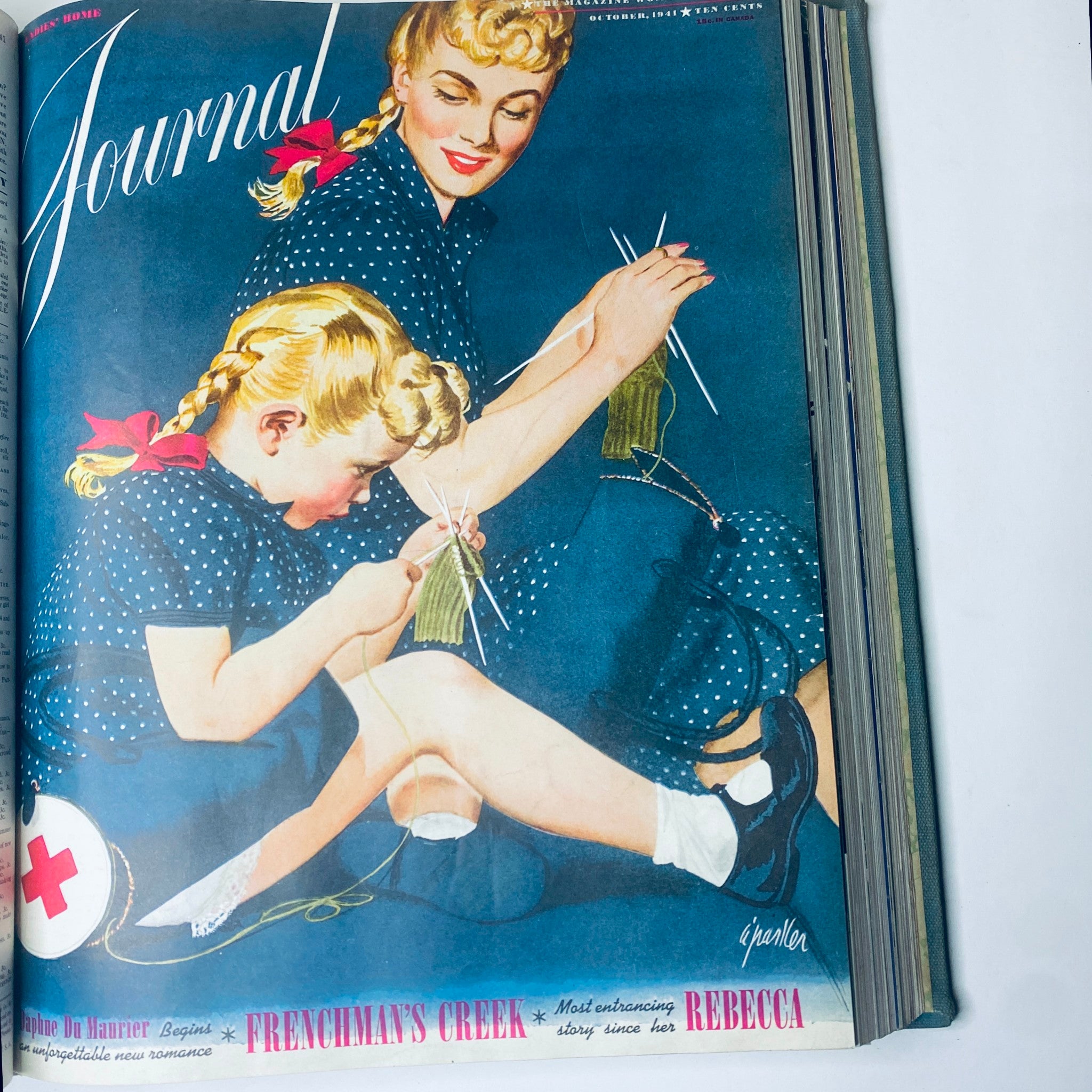Cover of Ladies' Home Journal October 1941 depicting a mother and daughter engaged in knitting. This image is included in the full year collection of 1941.