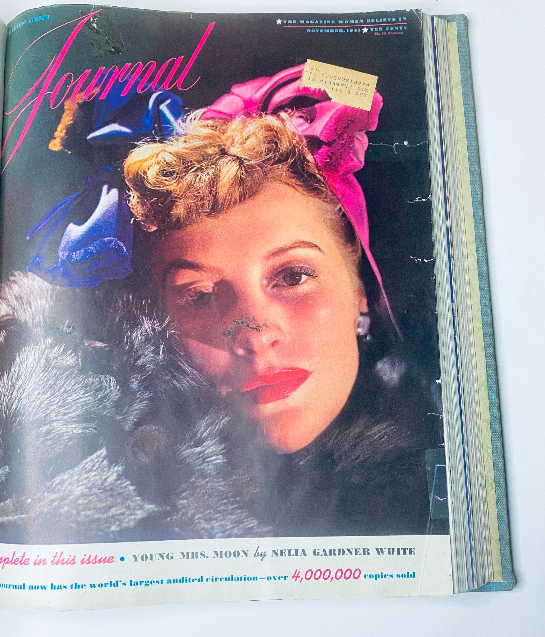 Cover of Ladies' Home Journal Bound Magazine 1941, featuring a woman with stylish hair and makeup, adorned with colorful accessories, showcasing the fashion trends of the early 1940s.