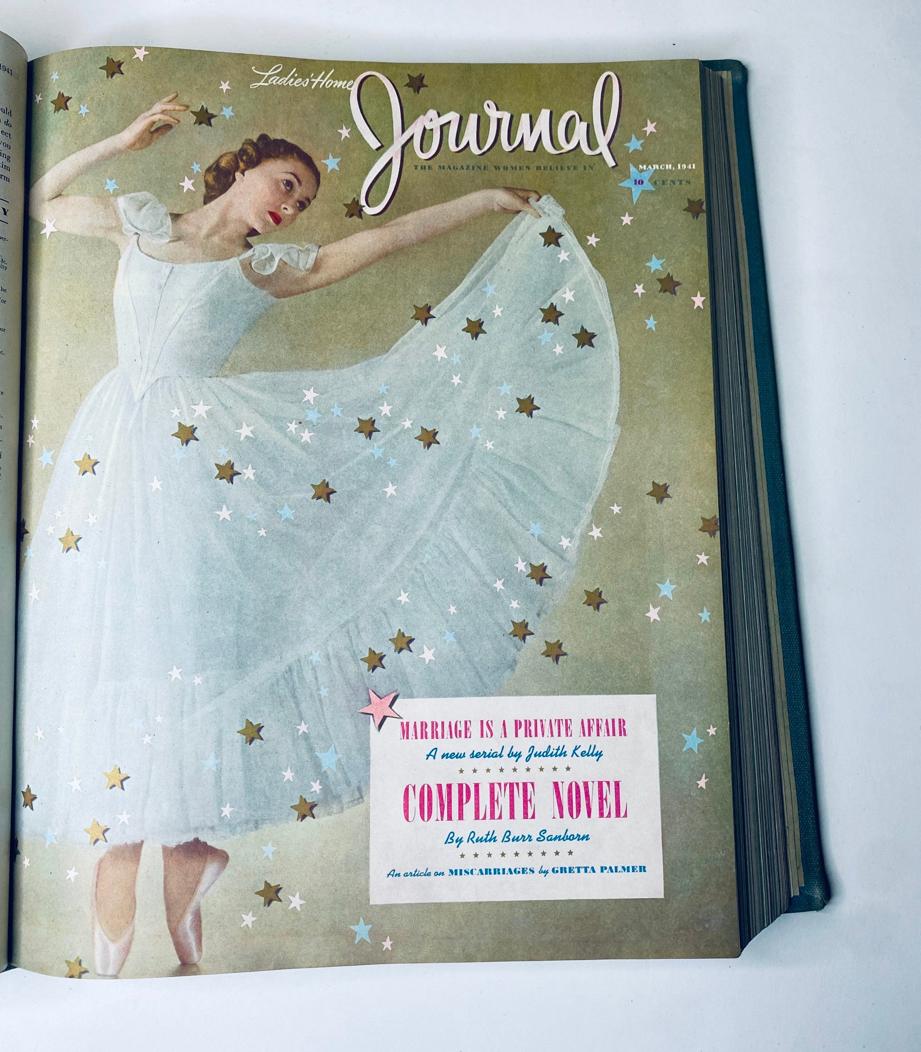 Cover of the March 1941 edition of Ladies' Home Journal featuring a woman in a flowing white dress surrounded by stars.