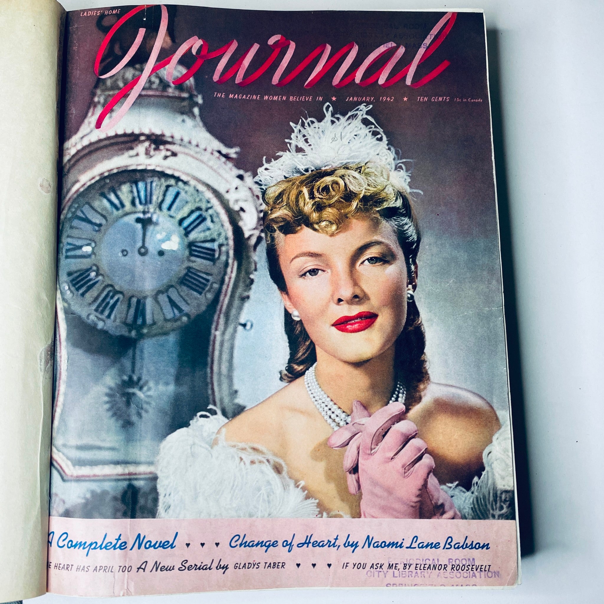 Ladies' Home Journal January 1942 magazine cover featuring a glamorous woman in formal attire against an antique clock backdrop.