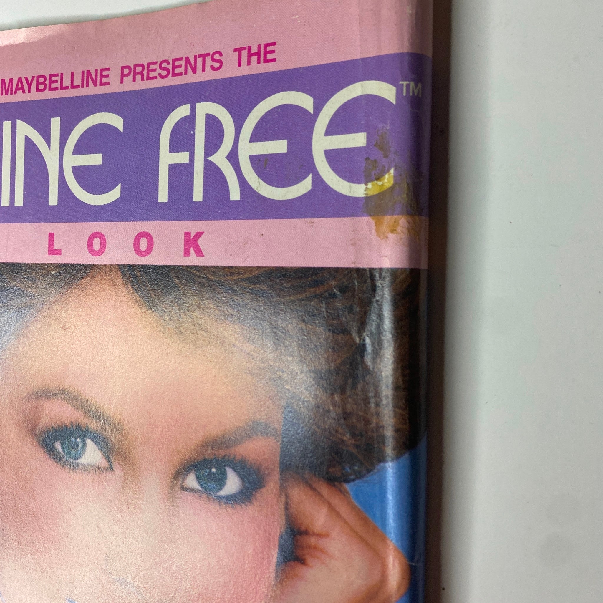 Close-up of the Maybelline Shine Free advertisement displaying a model's beauty features, from the March 1984 issue of Tiger Beat Magazine.