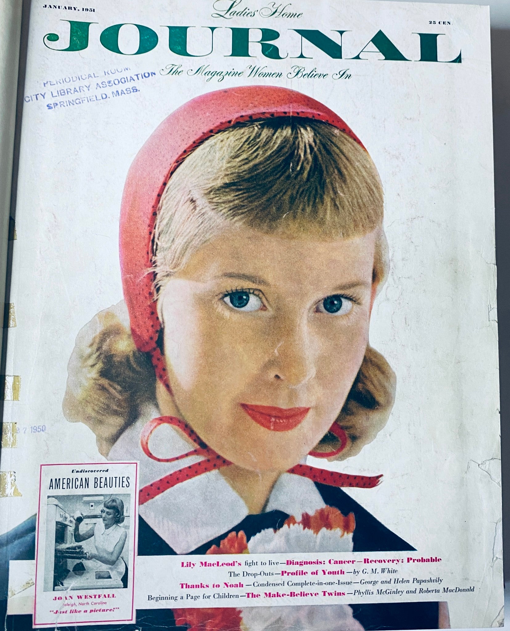 Cover of Ladies' Home Journal January 1951 featuring a woman with a red headband, exemplifying 1950s fashion.