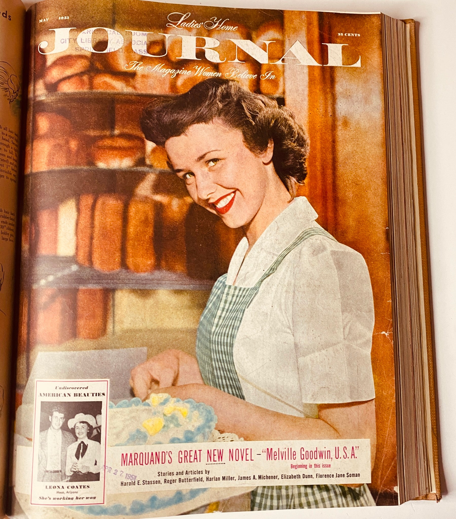 Cover of Ladies' Home Journal May 1951 magazine showcasing a woman in a kitchen with a bright smile, surrounded by freshly baked goods. This cover reflects the home-centric theme of the publication.