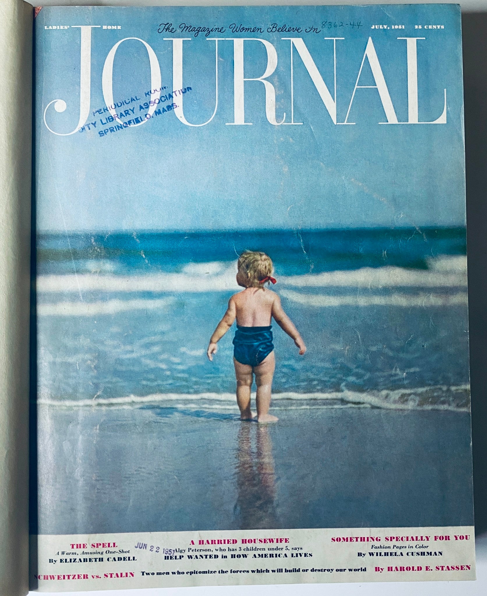 Cover of Ladies' Home Journal July 1951 magazine presenting a child playing on the beach, capturing a carefree summer moment. This image resonates with family life and outdoor activities during the 1950s.