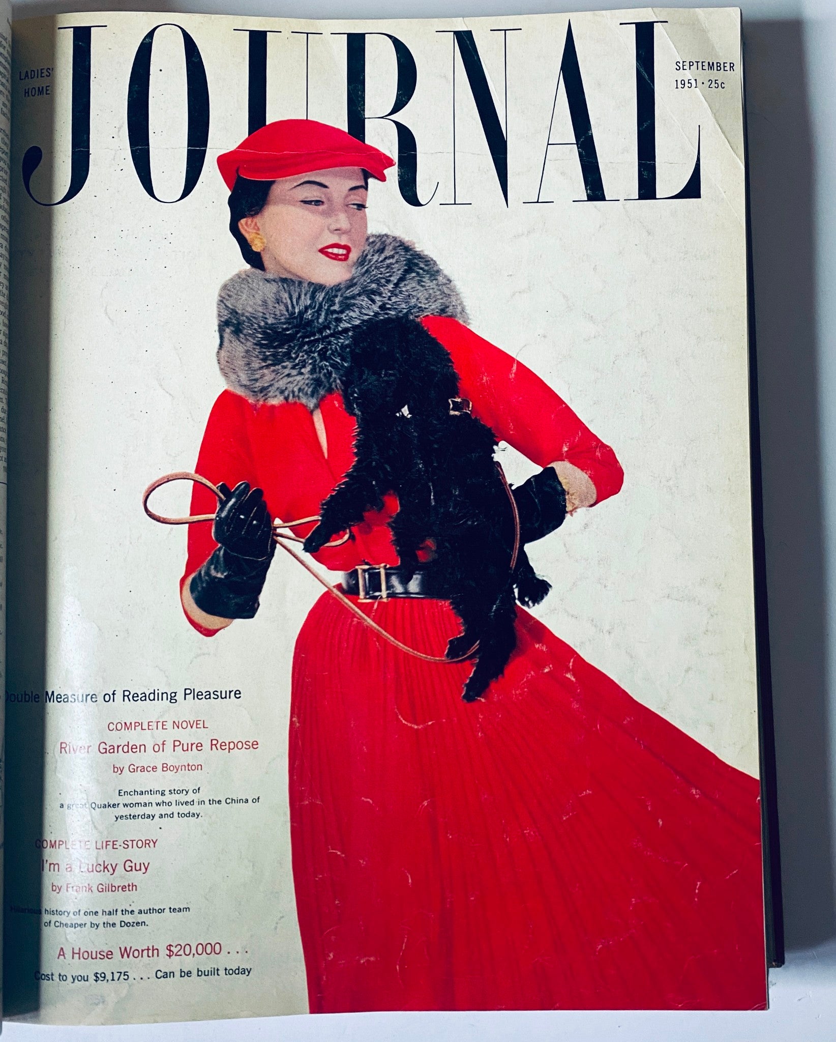 Cover of Ladies' Home Journal, September 1951, featuring a woman dressed in a red coat with fur trim, holding a black poodle. The title and date are prominently displayed.