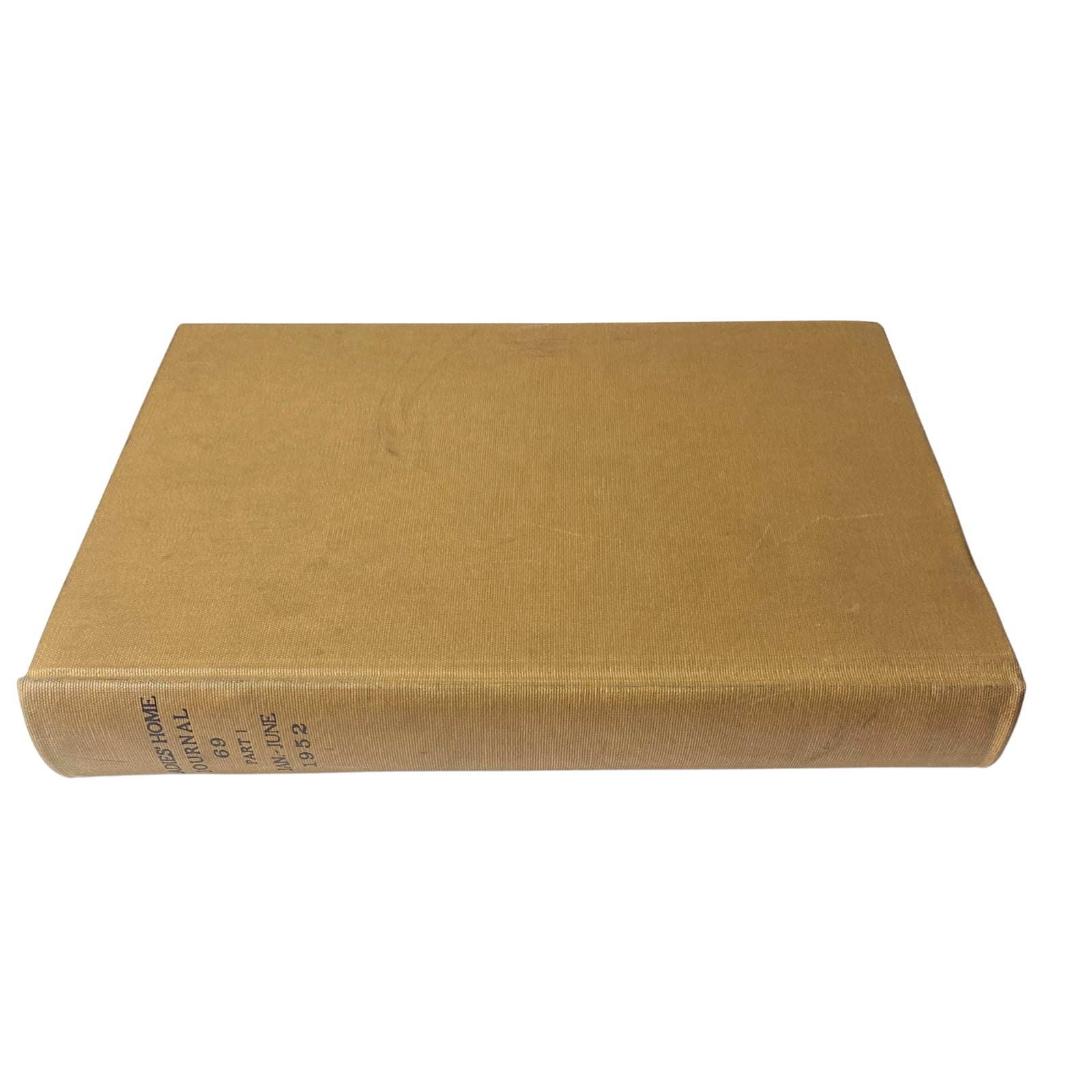 Ladies' Home Journal Library Bound Magazine 1952, illustrating the side view of a bound volume with clear labeling and vintage appeal.